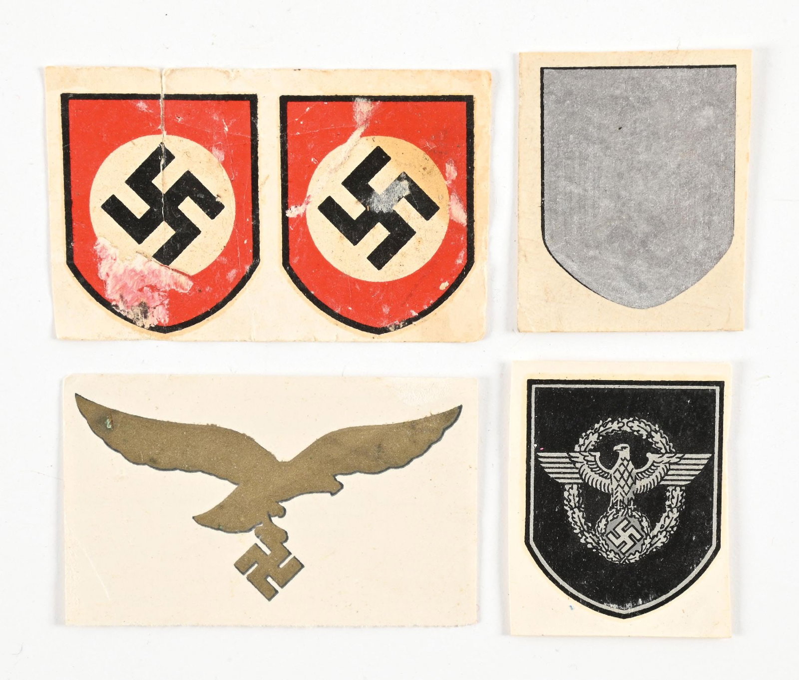 LOT OF GERMAN WWII HELMET DECALS.: Lot of German WWII helmet decals. Lot includes a Luftwaffe, Heer, and Polizei decal, as well as two tricolor decals (which are damaged) CONDITION: Overall very good.