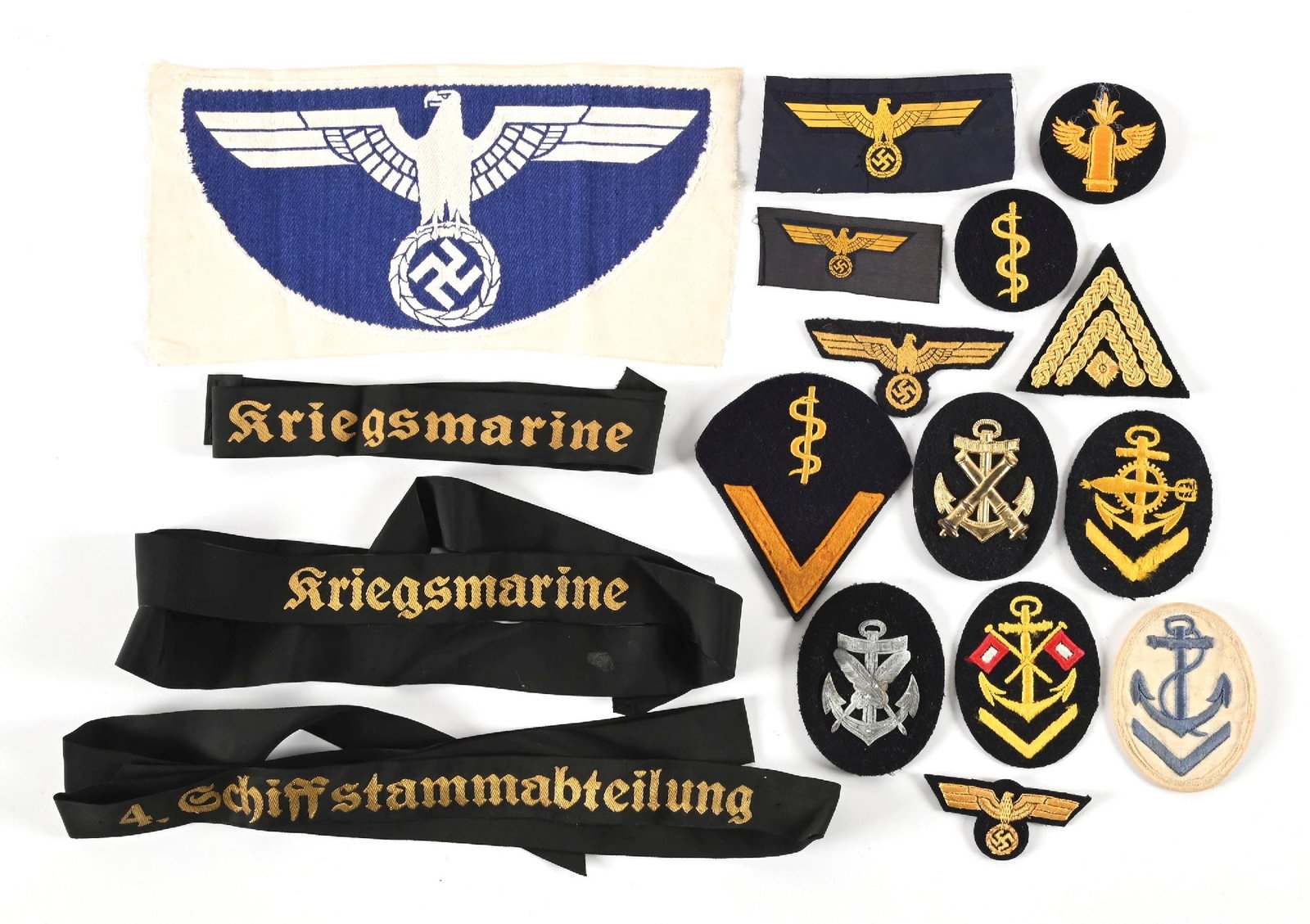 LOT OF GERMAN WWII KRIEGSMARINE INSIGNIA.: Lot of German WWII Kriegsmarine insignia. Lot includes athletic shirt eagle, sleeve patches, breast eagles, and cap tallies. CONDITION: Overall excellent.