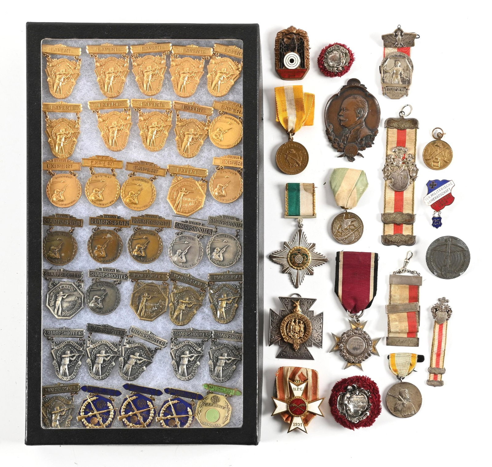 LARGE LOT OF (47) SHOOTING AND MARKSMAN MEDALS AND RIBBONS.: Lot includes (17) Schuetzen rifle or shooting medals, all foreign, mostly German to include three ribbons that have various silver bars & 1903 dated silver Frankford award. The balance of shooting Sch