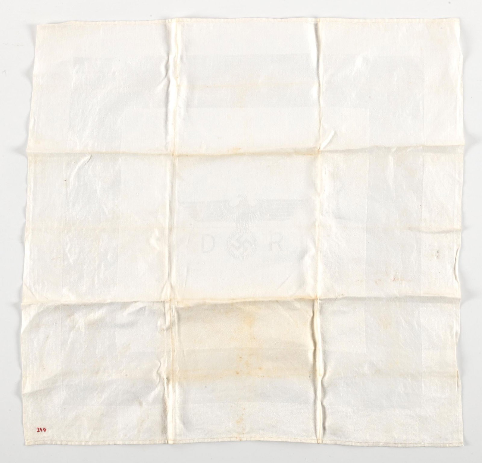 THIRD REICH ADOLPH HITLER'S TRAIN PLACE SETTING NAPKIN.: Third Reich Adolph Hitler's train dining wagon napkin. Napkin measures 22" x 22" and "244" is embroidered in red thread on the lower left. Napkin has a silky feel and exhibits light staining, especial