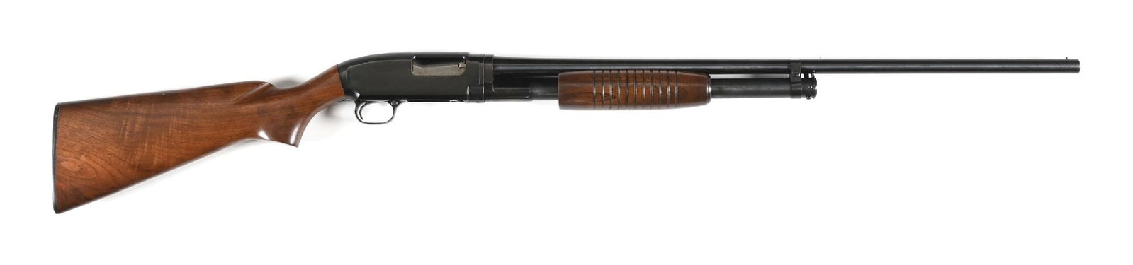 (C) HIGH CONDITION WINCHESTER MODEL 12 - 20 GAUGE SLIDE ACTION SHOTGUN: Dates to 1962. Standard field grade with dual tone blue finish, plain barrel, single bead front sight, plain pistol grip walnut stock with black Winchester butt plate and round grooved forearm. CONDIT