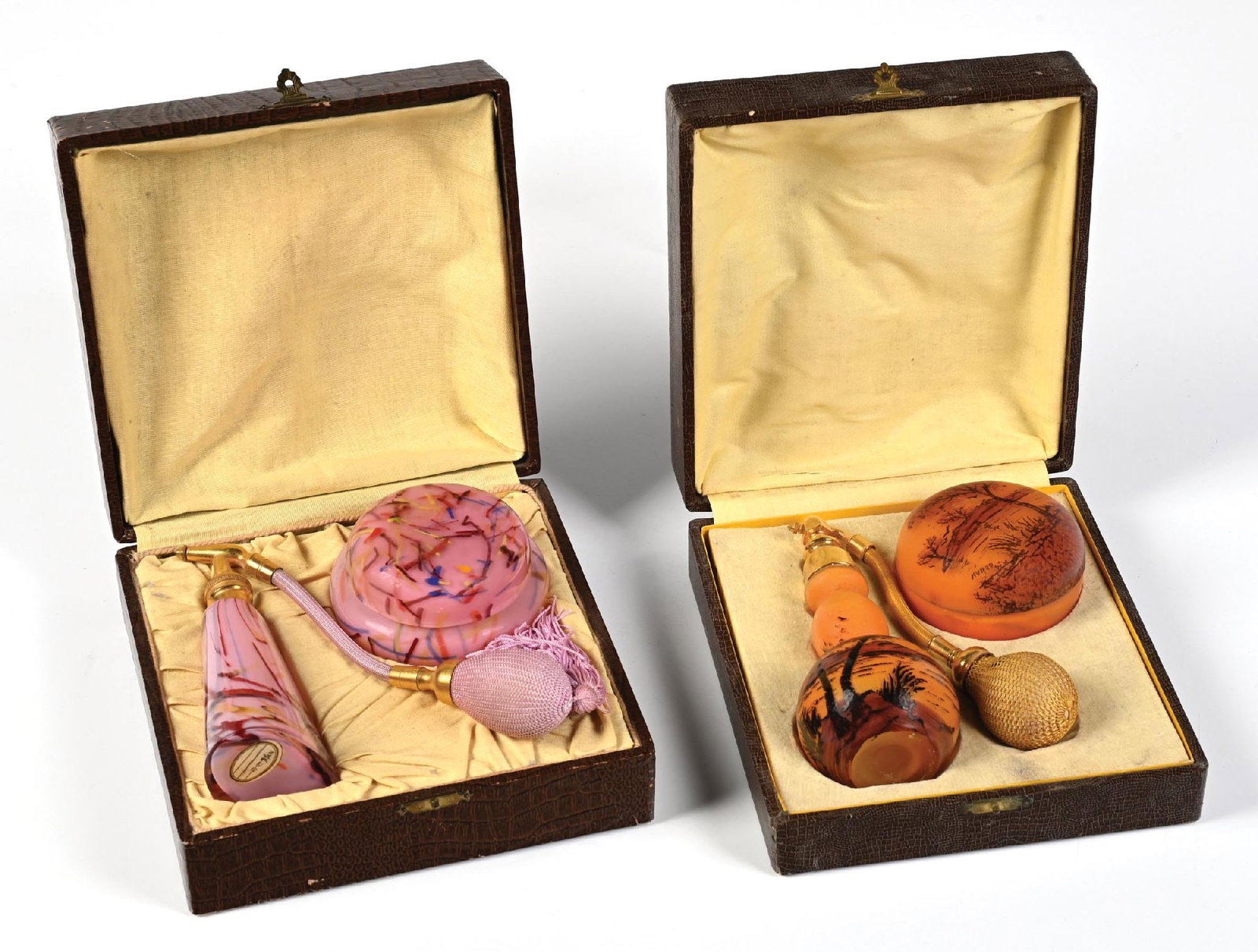 LOT OF 2: PERFUME ATOMIZER & POWDER BOX SETS: C. 1900s. (A) A stunning French vanity set in the original box. The set includes a compact and gourd-shaped glass perfume atomizer with a beautiful desert landscape painting. The perfume is signed GIV