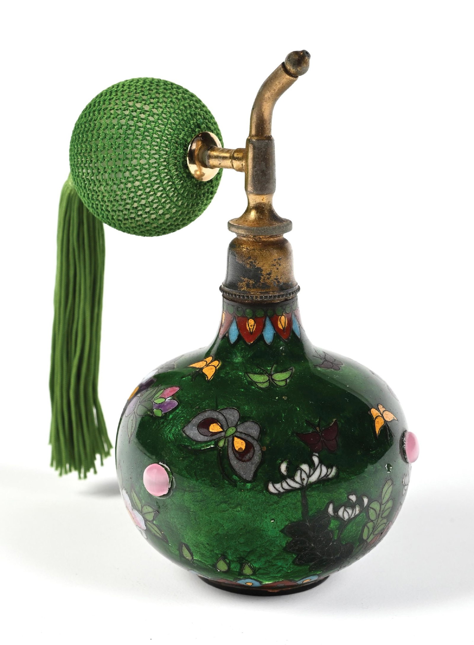 GREEN GLASS WITH ENAMELED FLOWERS PERFUME ATOMIZER: C. 1900s. A stunning green Cloisonné perfume atomizer with a metallic green, swirled base on a bulbous body and intricate decorative designs, including florals and butterflies. The perfume featur