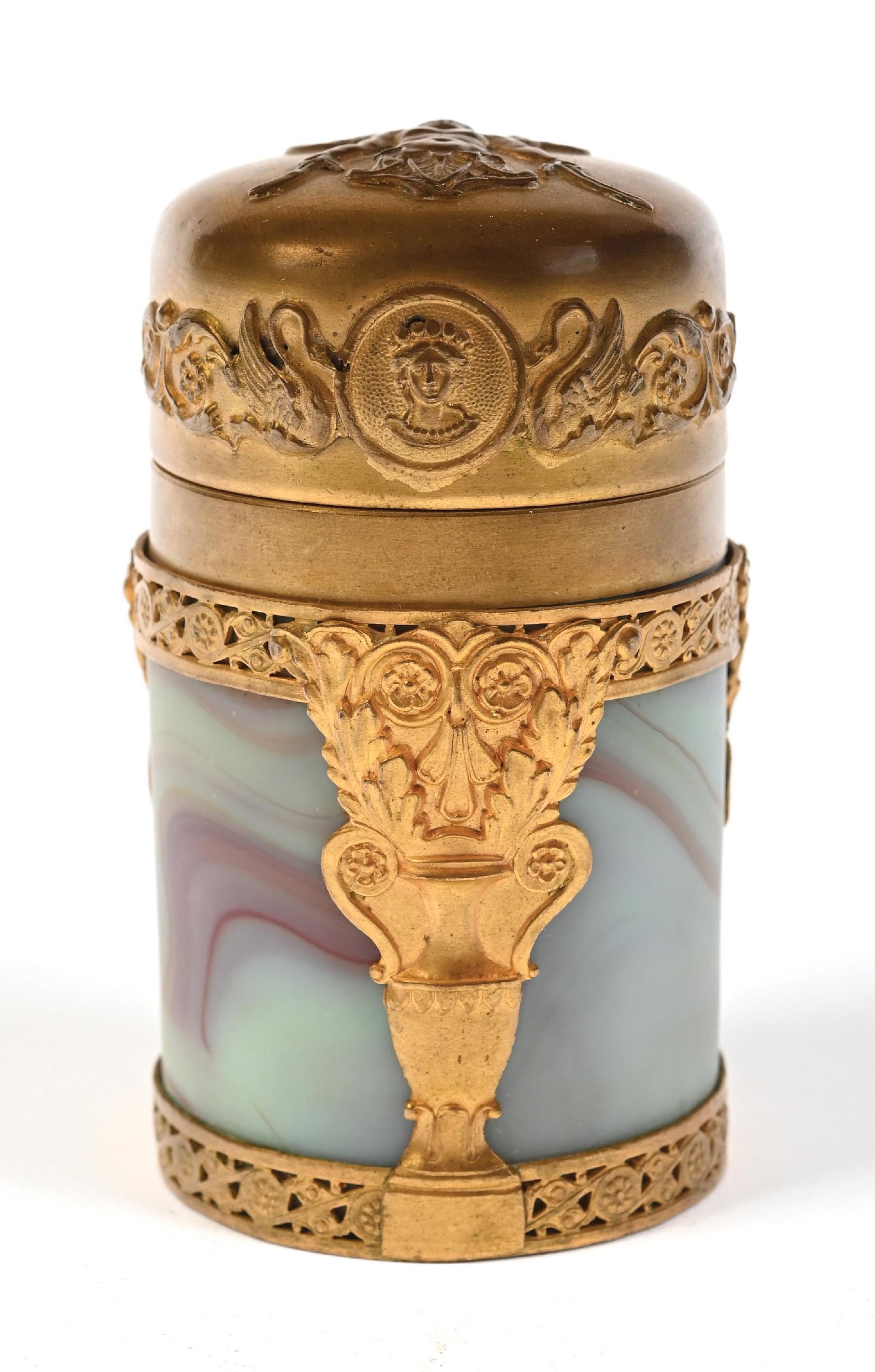 FRENCH BRASS OVERLAY SLAG GLASS PERFUME BOTTLE: C. 1900s. A French gilt ormolu and agate banded perfume bottle. The piece features an intricate gilt-bronze mount and a hinged lid with elaborate scrollwork and a mythological figural motif. The body 