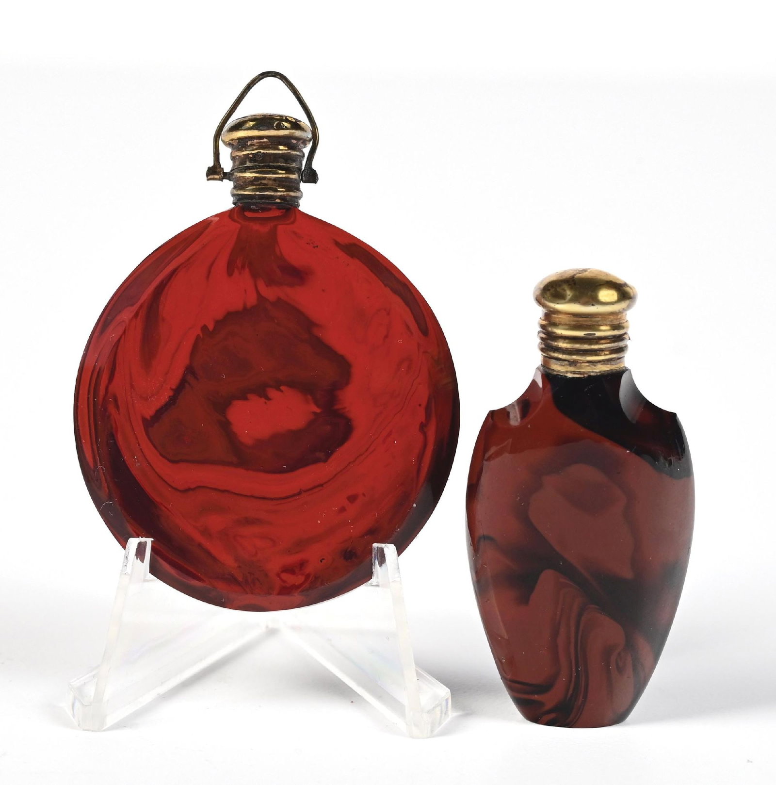 LOT OF 2: BOHEMIAN HYALITH MINIATURE PERFUME BOTTLES: C. 1800s. A collection of two travel-sized perfumes with highly decorative red and maroon Hyalith glass. The perfumes are in very wonderful condition. Largest: 1-3/4" x 2-1/2". Condition: 125 Dimensio