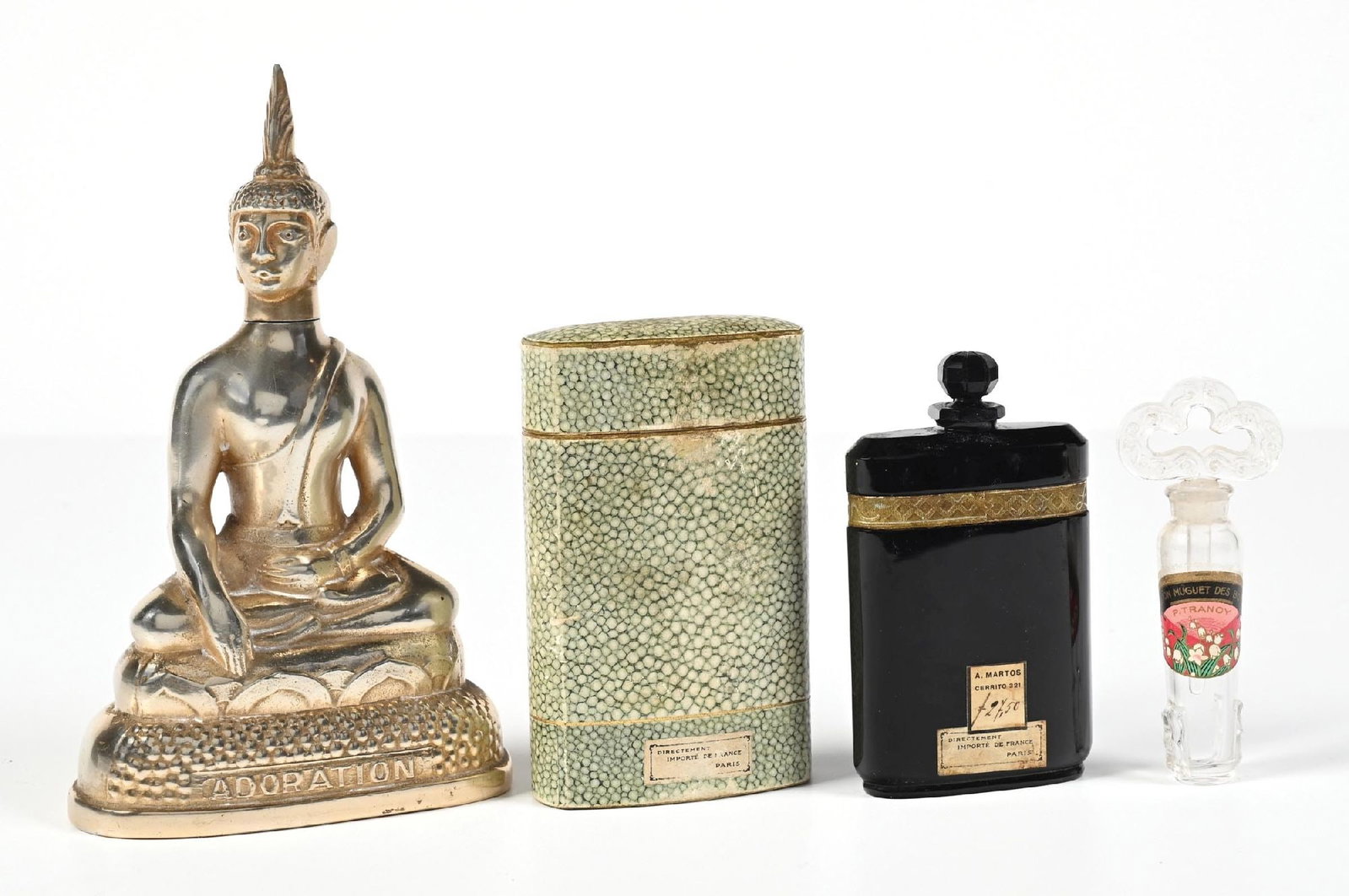 LOT OF 3: VARIOUS FRENCH STYLE PERFUME BOTTLES: C. 1900s. (A) A large silver-toned Buddha perfume with significant chipping around the inner glass lip and a chip on the stopper, reads "ADORATION," made in France. (B) A "Savon Muguet Des Bois" comme