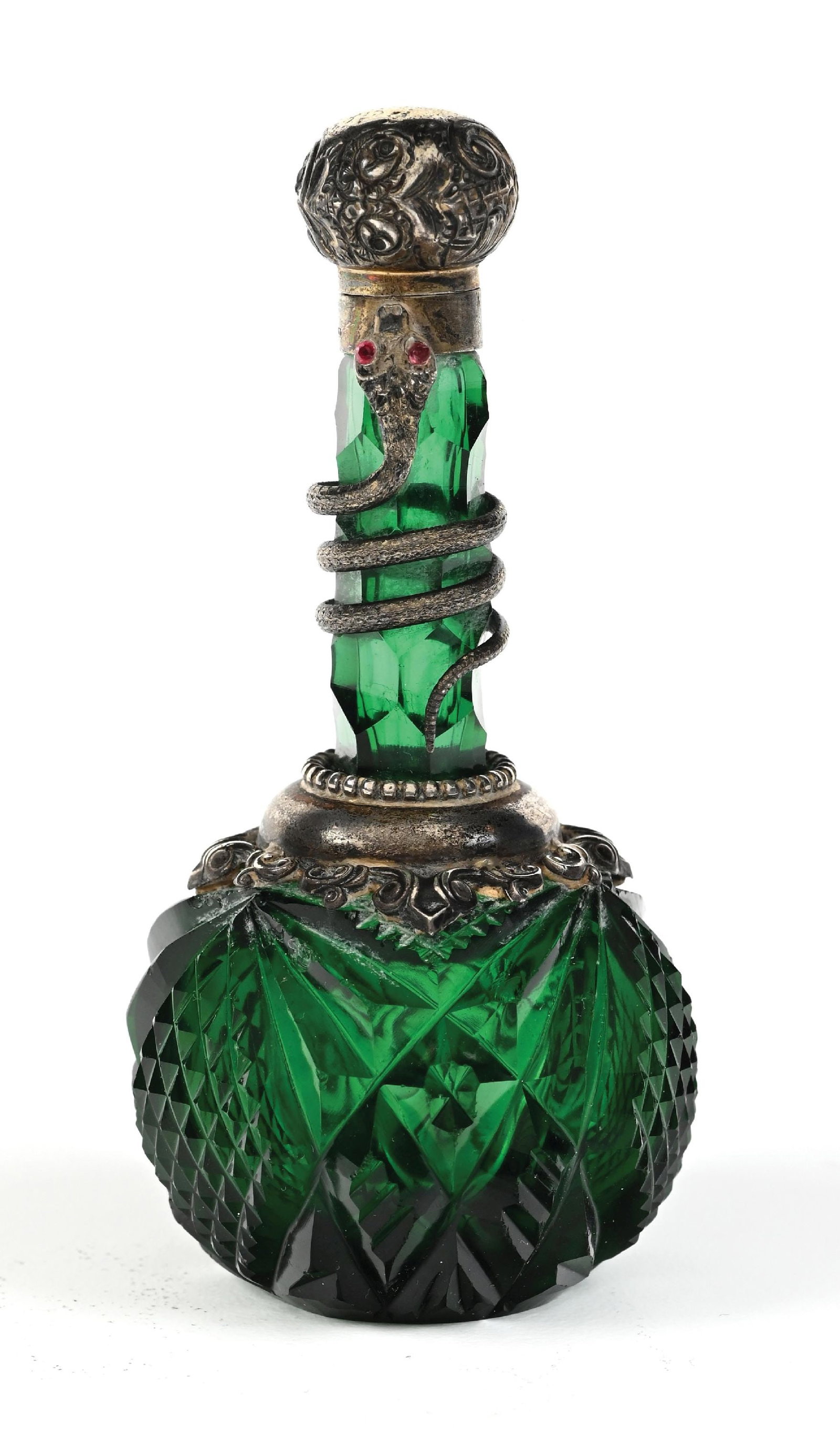 EMERALD GREEN GLASS SNAKE PERFUME BOTTLE: C. 1800s. A stunning emerald-green cut-glass perfume with diamond facets, an ornate silver collar, and a silver-plated snake that spirals up the hinged cap; the cap hinge no longer functions, but the 