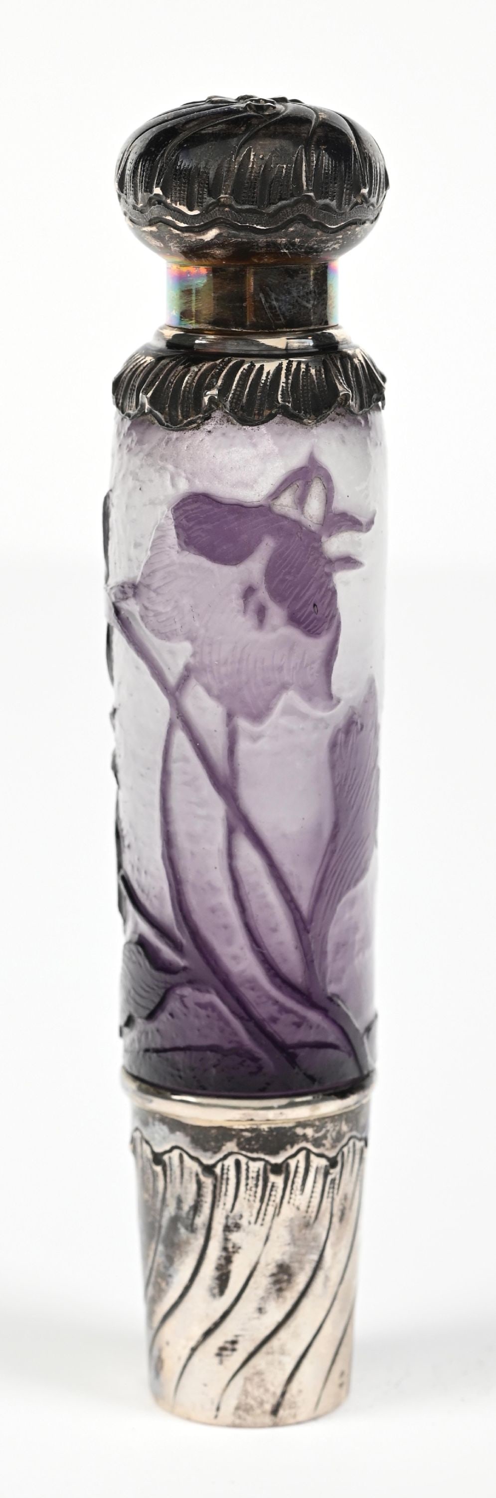 DAUM ART NOUVEAU PURPLE CAMEO GLASS PERFUME BOTTLE WITH FLORAL MOTIF: C. 1880s. A fantastic textured cameo glass opera flask with beautiful floral reliefs, adorned with a sterling silver tumbler cup and a matching screw-top lid. Light, gentle wear consistent with age. 1