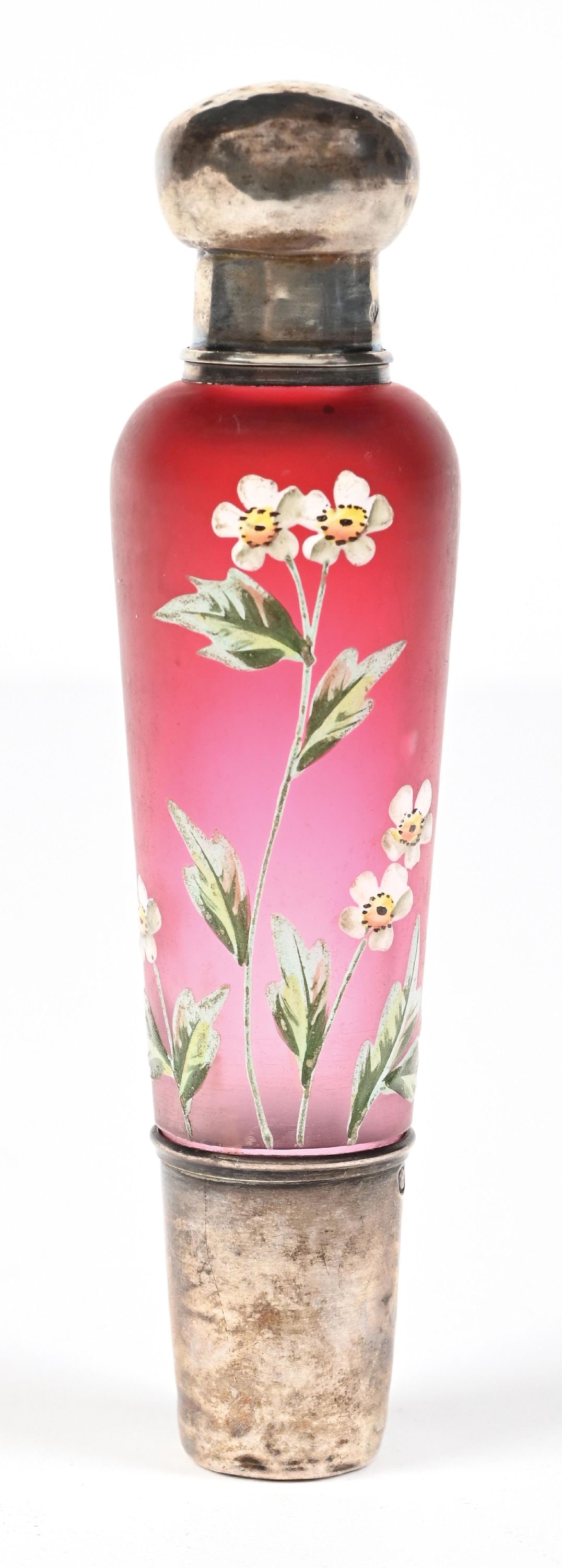 DAUM RED SATIN FINISH WITH FLORAL DESIGN PERFUME BOTTLE: C. 1800s. A fantastic Daum traveling opera spirits bottle featuring an ombre cranberry-colored frosted glass body with hand-painted decorative floral enamel and a sterling silver detachable tumbler-cu