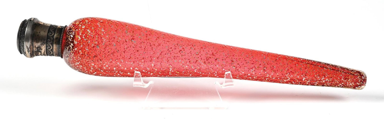 MURANO AVENTURINE GLASS LAY-DOWN PERFUME BOTTLE: C. 1800s. A long cranberry glass lay-down perfume encrusted with gold-toned internal flecks. The top is decorated with a silver top that reads "Ethel" on the top, and has two unidentifiable stamps on 