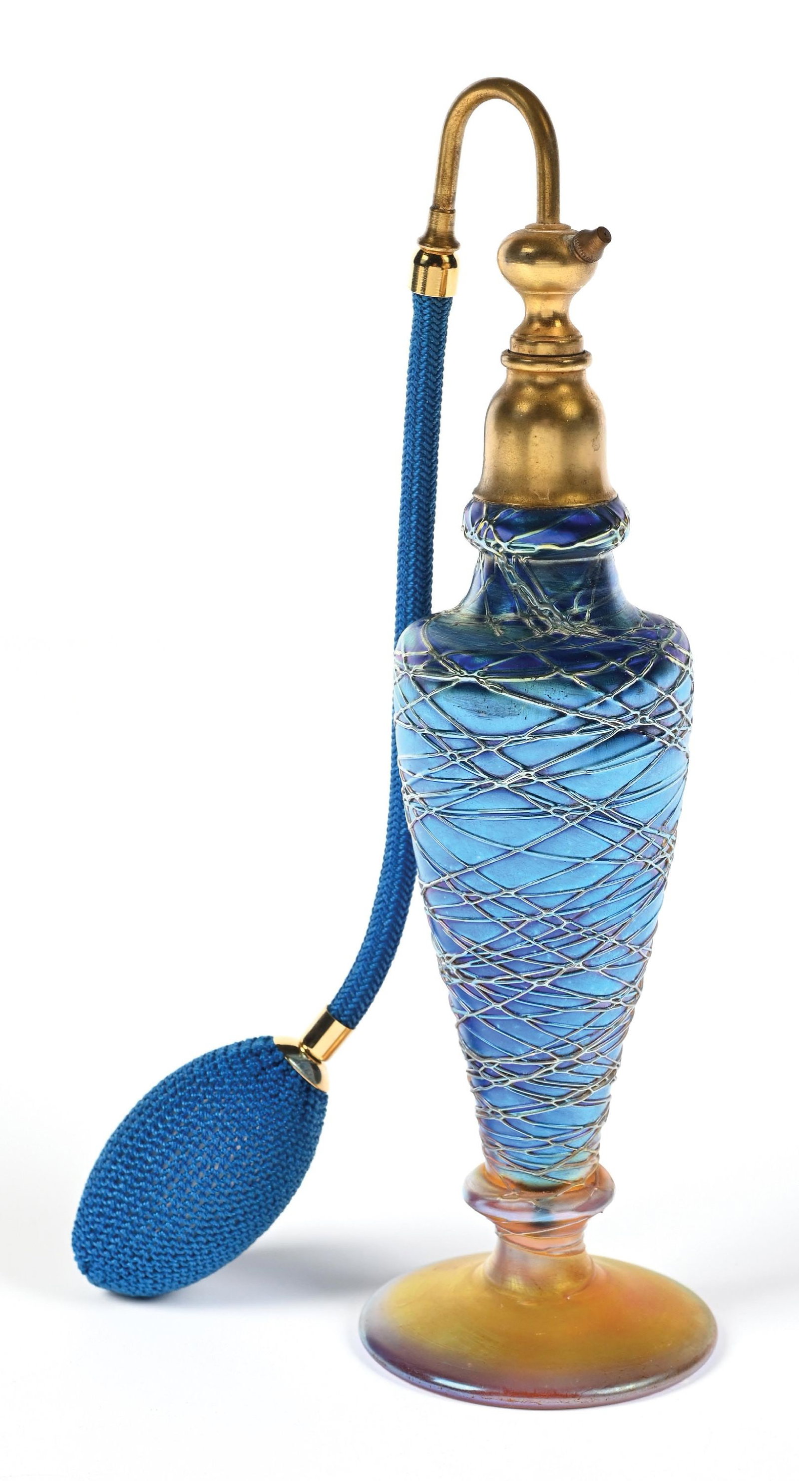 DURAND THREADED COBALT ART GLASS PERFUME ATOMIZER: C. 1920s. A beautiful iridescent cobalt Durand-threaded art glass perfume with a functional puff. The perfume features a stunning orange iridescent base and a gold gilt atomizer. In great condition. 3