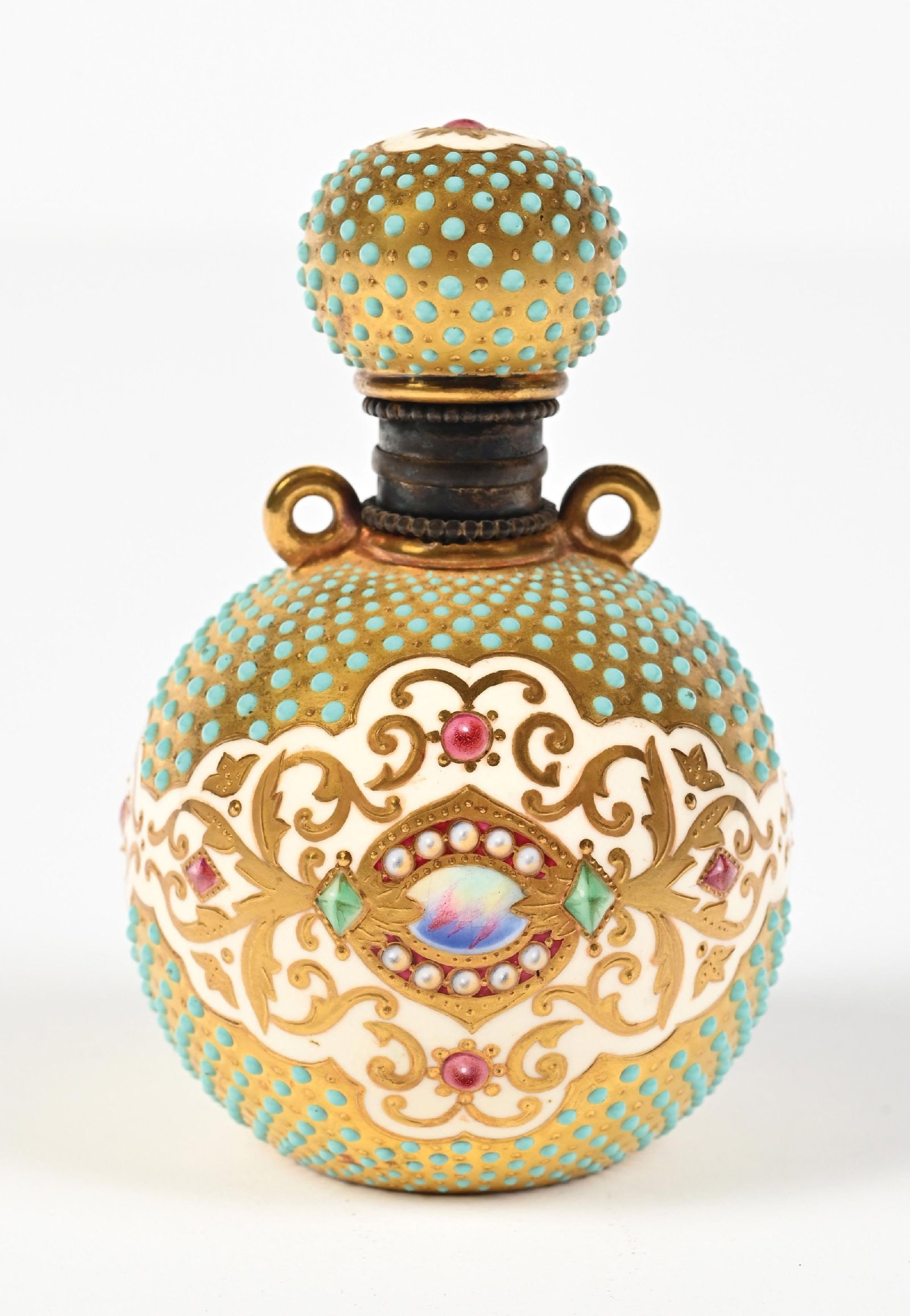 ORNATE COALPORT BLUE JEWELED PERFUME WITH ENAMEL ACCENTS: C. 1800s. A beautiful jeweled Coalport porcelain perfume bottle made in England. It features a turquoise enamel jewel on a gold ground. The center band and top of the cover are adorned with platinum