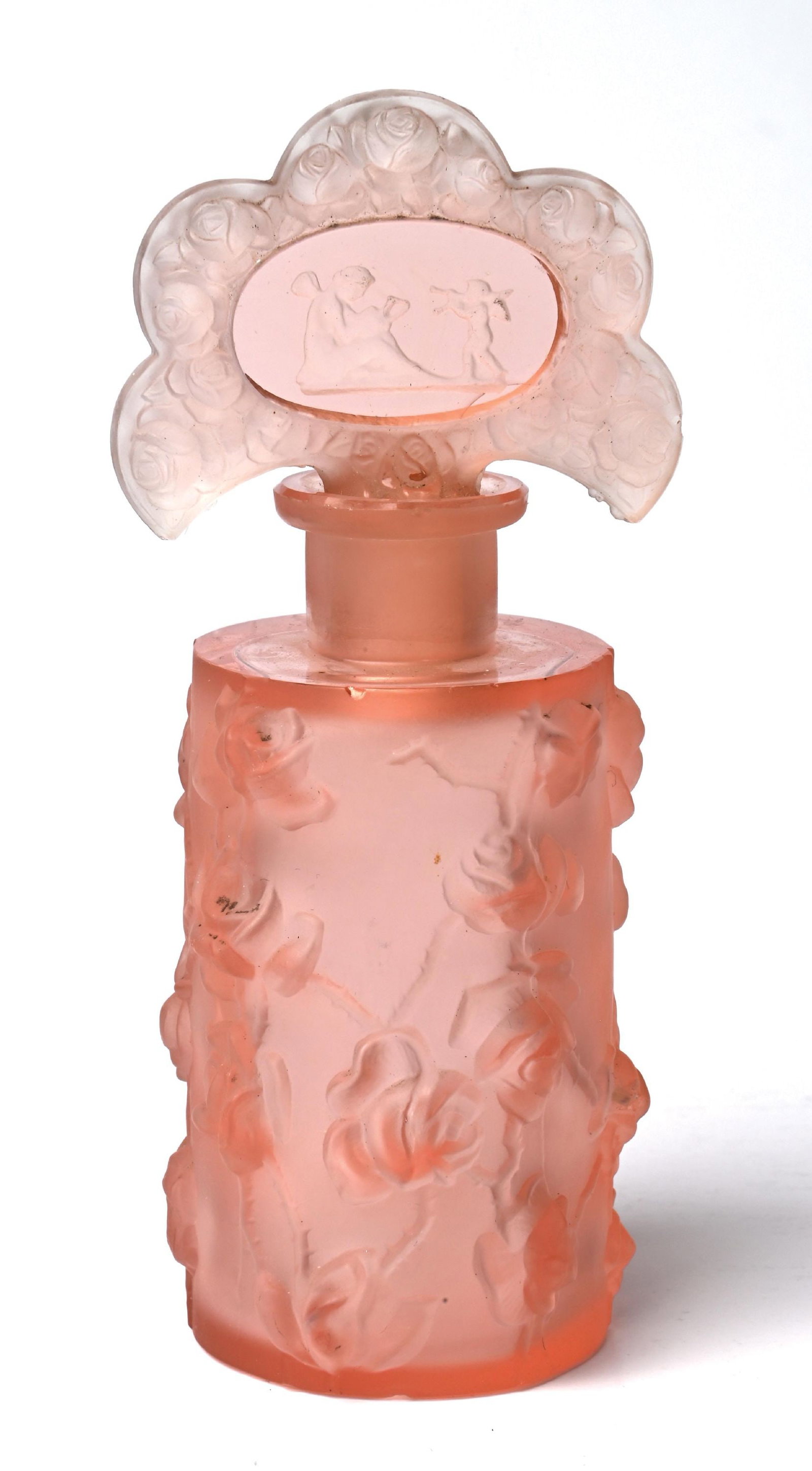 HEINRICH HOFFMAN ART NOUVEAU PINK FROSTED PERFUME BOTTLE: C. 1900s. A lovely, small crystal-sculptural perfume with a frosted pink finish. The perfume features a lovely, raised cameo-style relief with a rose floral pattern. The fan topper has a figural and c