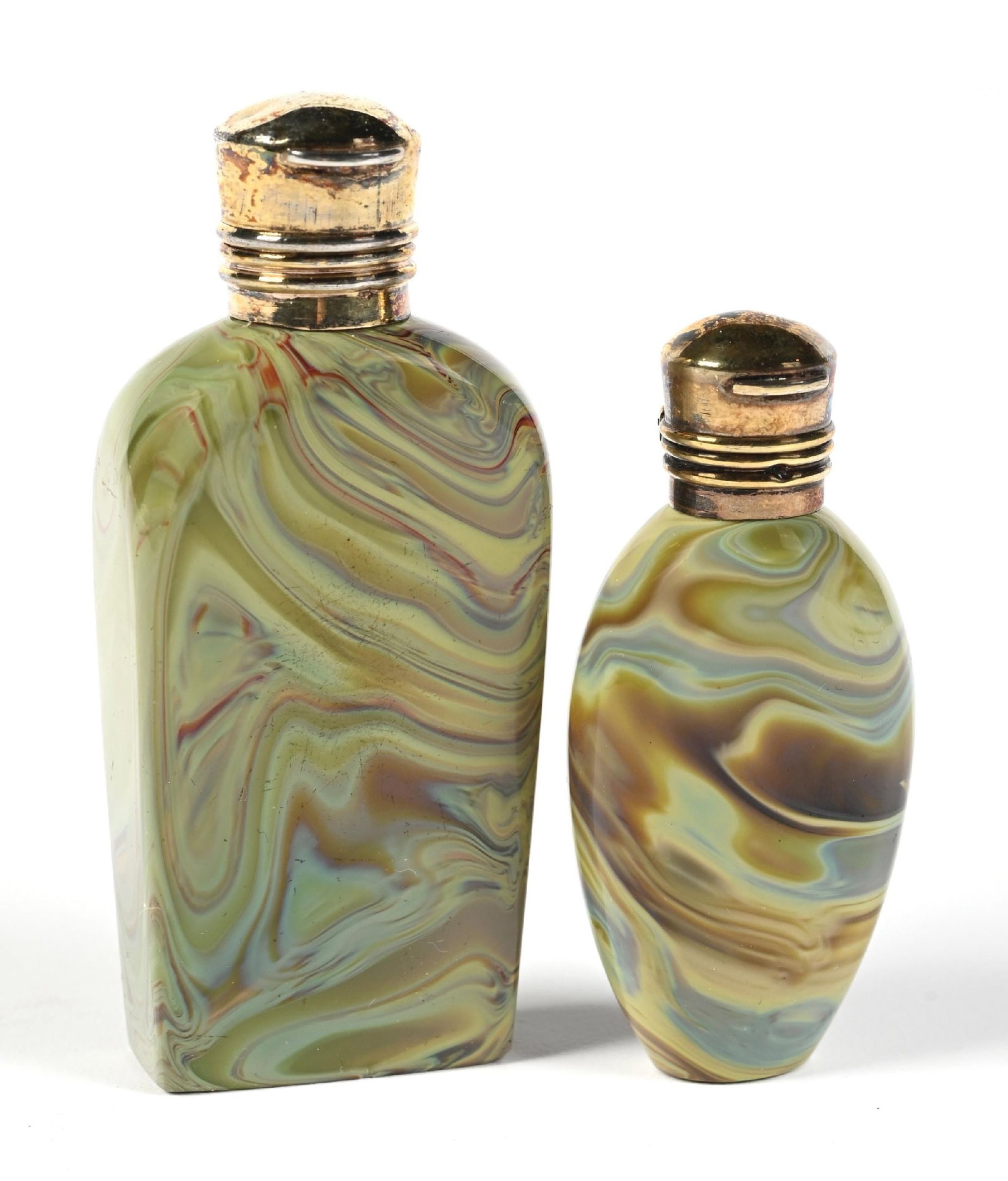 LOT OF 2: MARBLED GLASS PERFUME BOTTLES: C. 1800s. A striking pair of small flattened glass bottles with a fabulous psychedelic marbled pattern with swirls of yellow, lime green, pale blue, and hints of brown and red. Both of the bottles fea