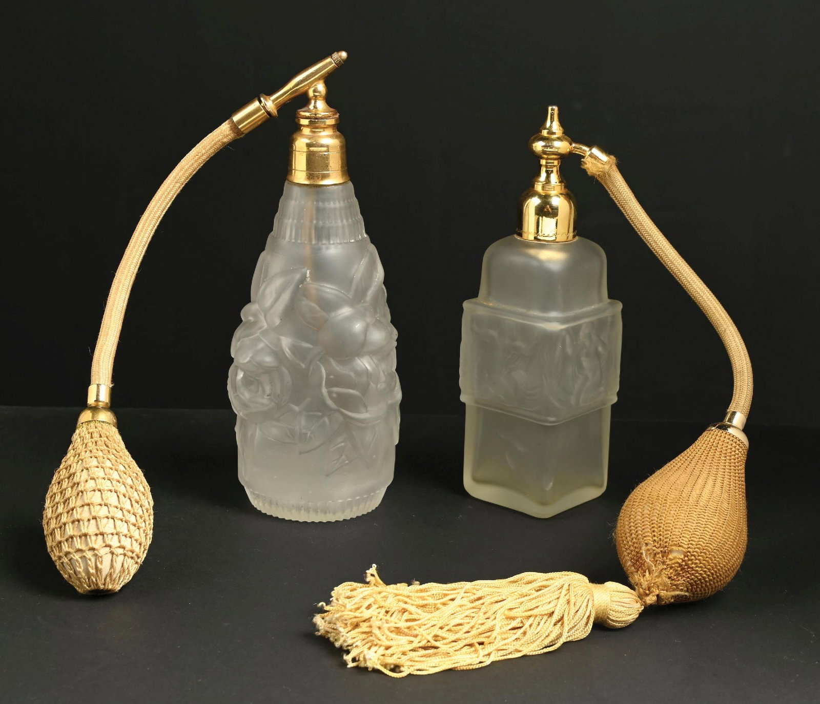 LOT OF 2: MOLINARD HABINITA FROSTED NUDE & FROSTED ROSE PERFUME WITH ATOMIZERS: C. 1920s. (A) A fantastic Molinard Habinita commercial frosted figural glass perfume atomizer with a gold metal atomizer and gold tasseled functional puff. In great condition. (B) A great French Art D