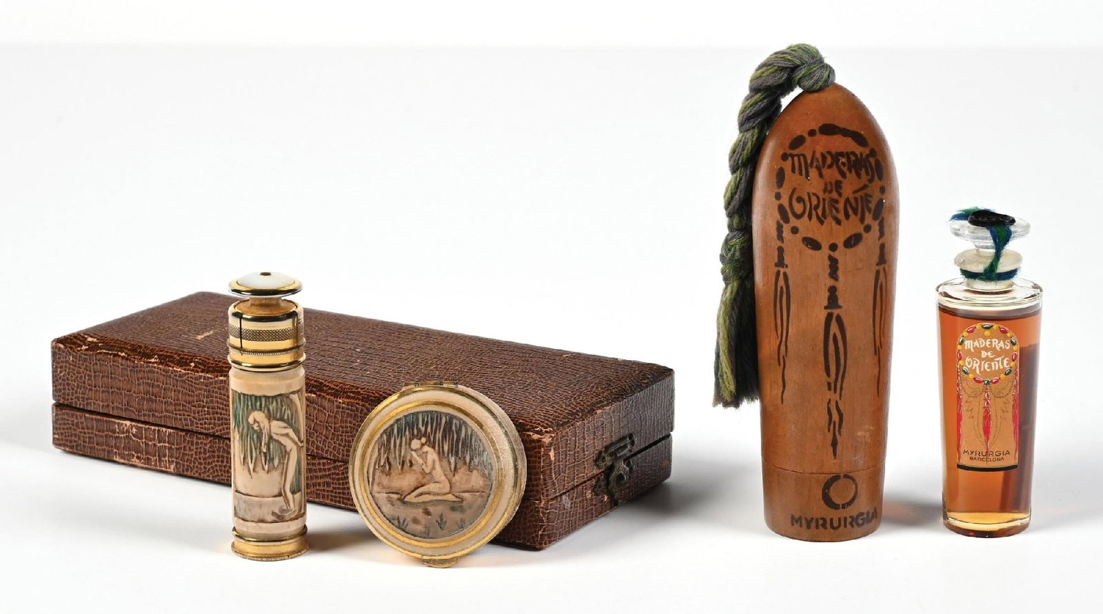 LOT OF 2: L'AIGLON PERFUME SET & CASED MYRURGIA PERFUME BOTTLE: (A) C. 1920s. L'Aiglon Brevette French perfume and full powder compact in the original case with enamel figural designs. The case shows signs of having tape on it at some point. The compact and perfum