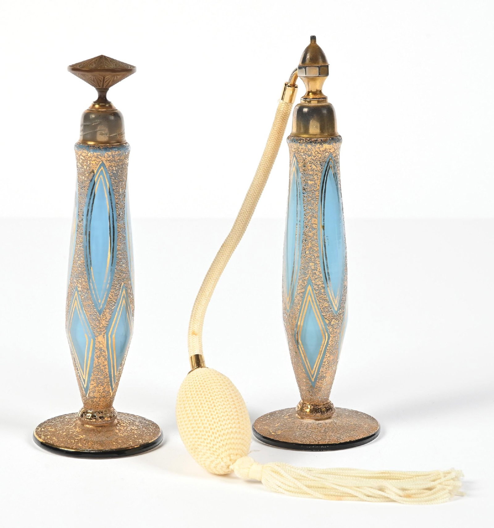LOT OF 2: MARCEL FRANCK GOLD GILTED LIGHT BLUE ART DECO PERFUMES: C. 1920s. A fantastic pair of light blue art deco perfumes with geometric patterns, signed on the collar, "MARFRAN PATENTED FRANCE" for Marcel Franck. The body as well as the base features a wonderful