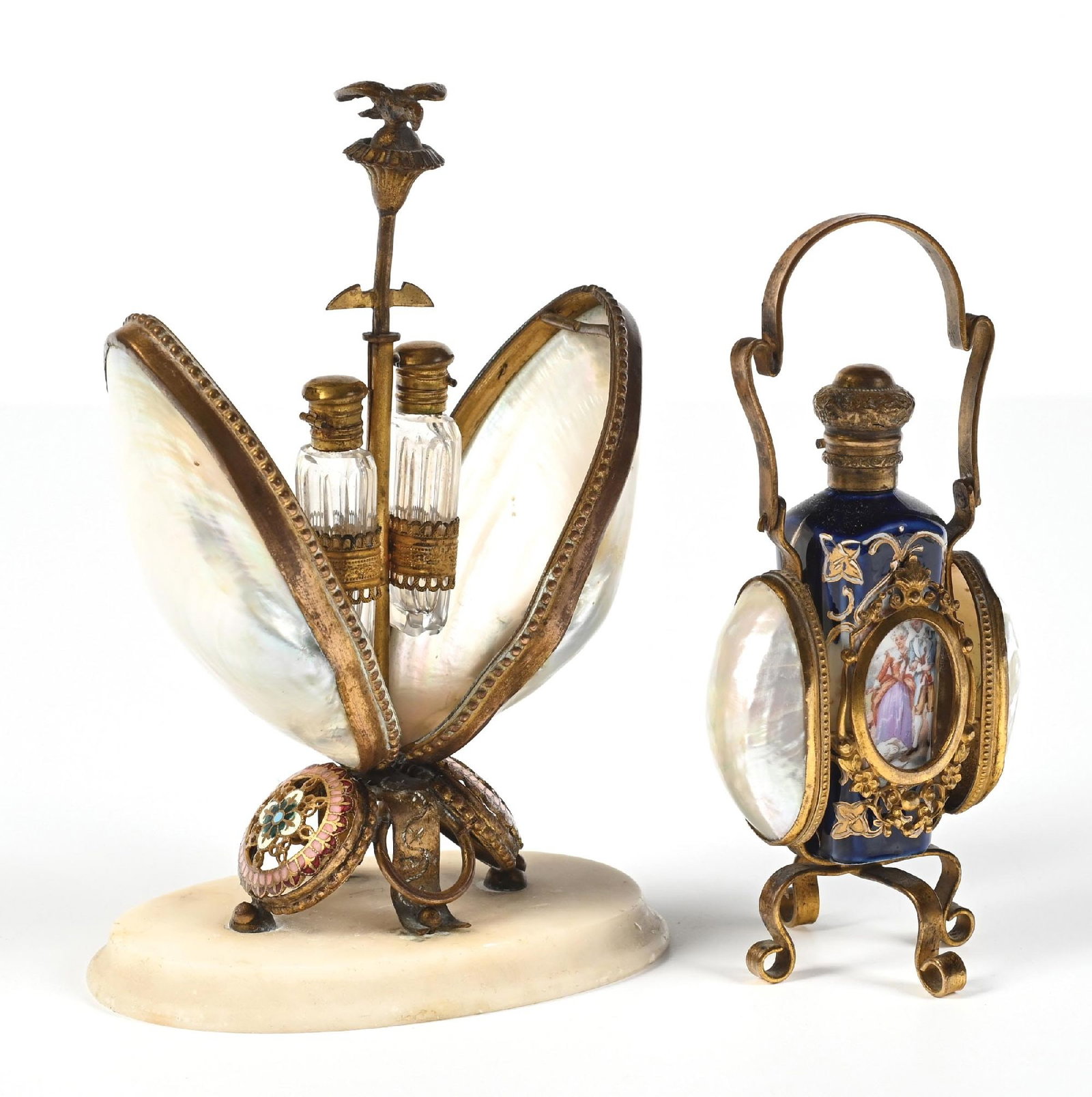 LOT OF 2: MOTHER-OF-PEARL EGG-SHAPED PERFUME CASES: C. 1800S. (A) A fantastic French Palais Royal perfume caddy featuring two large mother-of-pearl shells with a mechanical bird finial; when pressed down, it opens to reveal two clear glass miniature pe