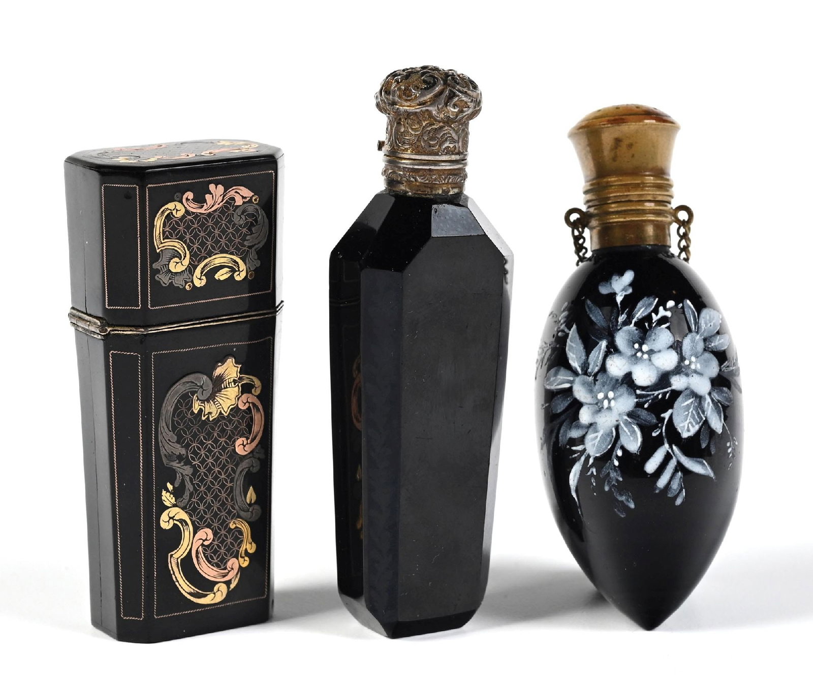 LOT OF 3: HYALITH GLASS MINIATURE PERFUME AND BLACK CASE WITH BOTTLES: C.1800s. Group of three black glass perfume bottles, including two Hyalith examples with floral gilt decoration and hand-painted enamel accents, and one black perfume case with mixed-metal-toned flora