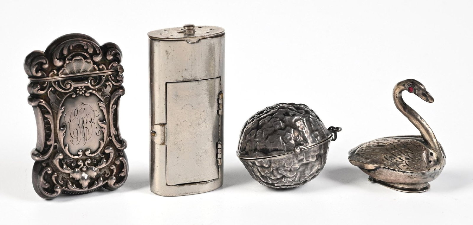 LOT OF 4: PERFUME HOLDER & MATCH SAFE: C.1800s. A group of four antique silver accessories, including: (A) a silver match holder with a hidden compartment for a photograph; (B) a tobacco case with a match compartment; (C) a silver walnut-f