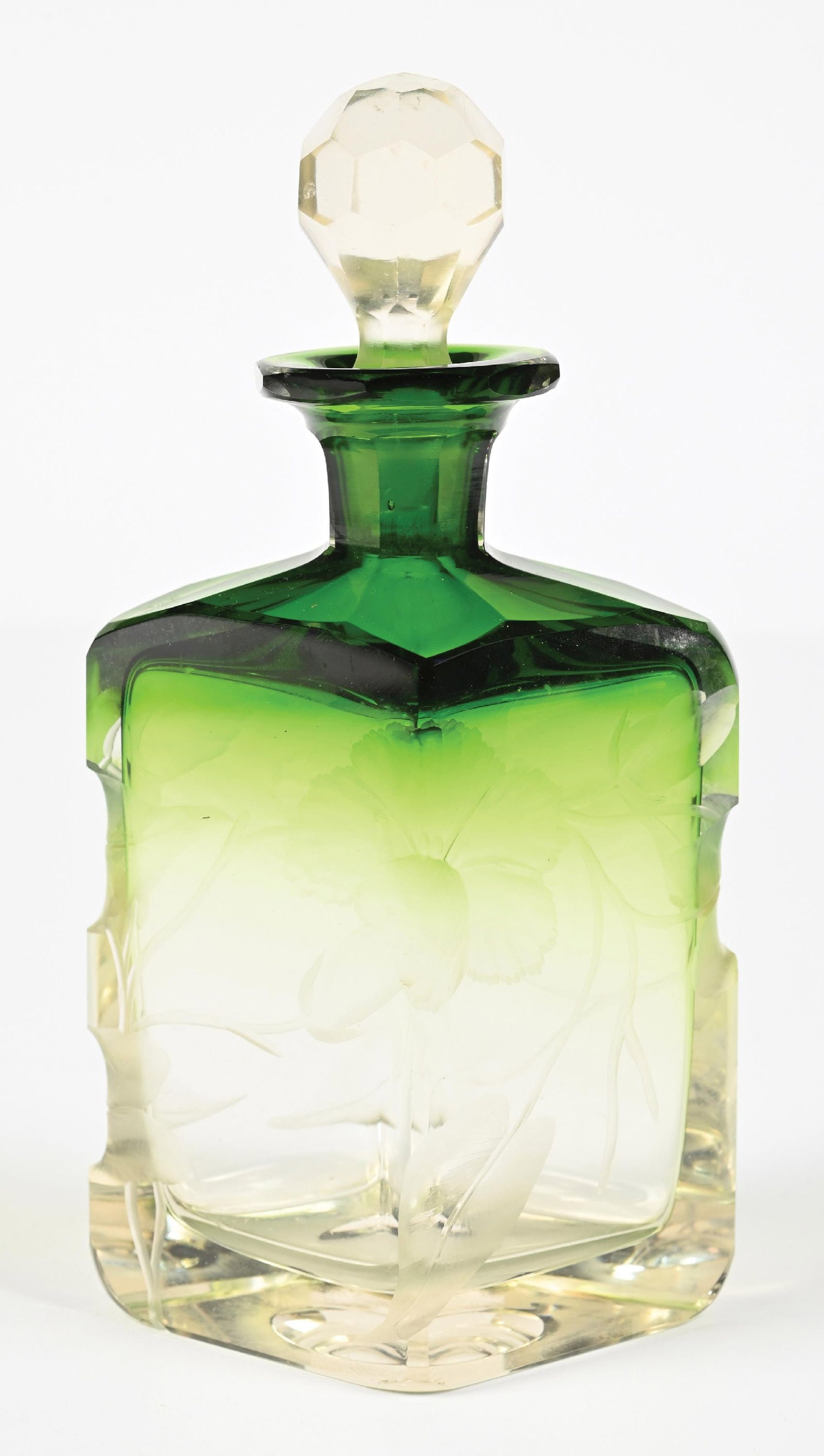 MOSER HARRACH GREEN TO CLEAR GLASS PERFUME BOTTLE: C. 1900. A cheerful Moser Harrach Intaglio cut green-to-clear cased glass perfume bottle. It features flowers and leaves on the crystal base, along with the faceted stopper. Very good overall, typical