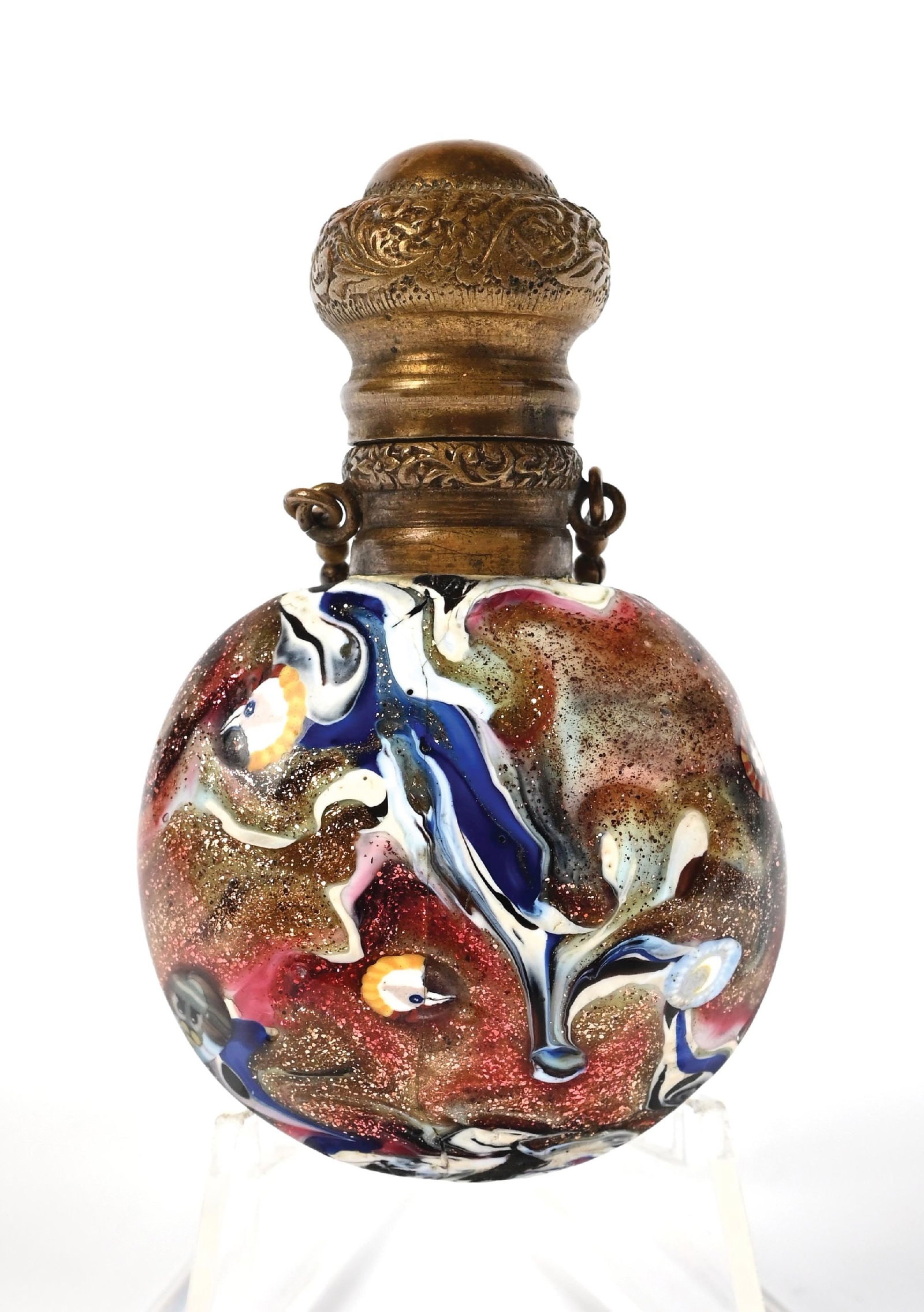 MURANO AVENTURINE GLASS PERFUME BOTTLE: C. 1800s. A spectacular aventurine multicolored swirl art glass with Millefiori inclusions, likely Venetian. It is in great condition. 1 - 1/2" x 2 - 1/2". Condition: 125 Dimensions: (Excellent).
