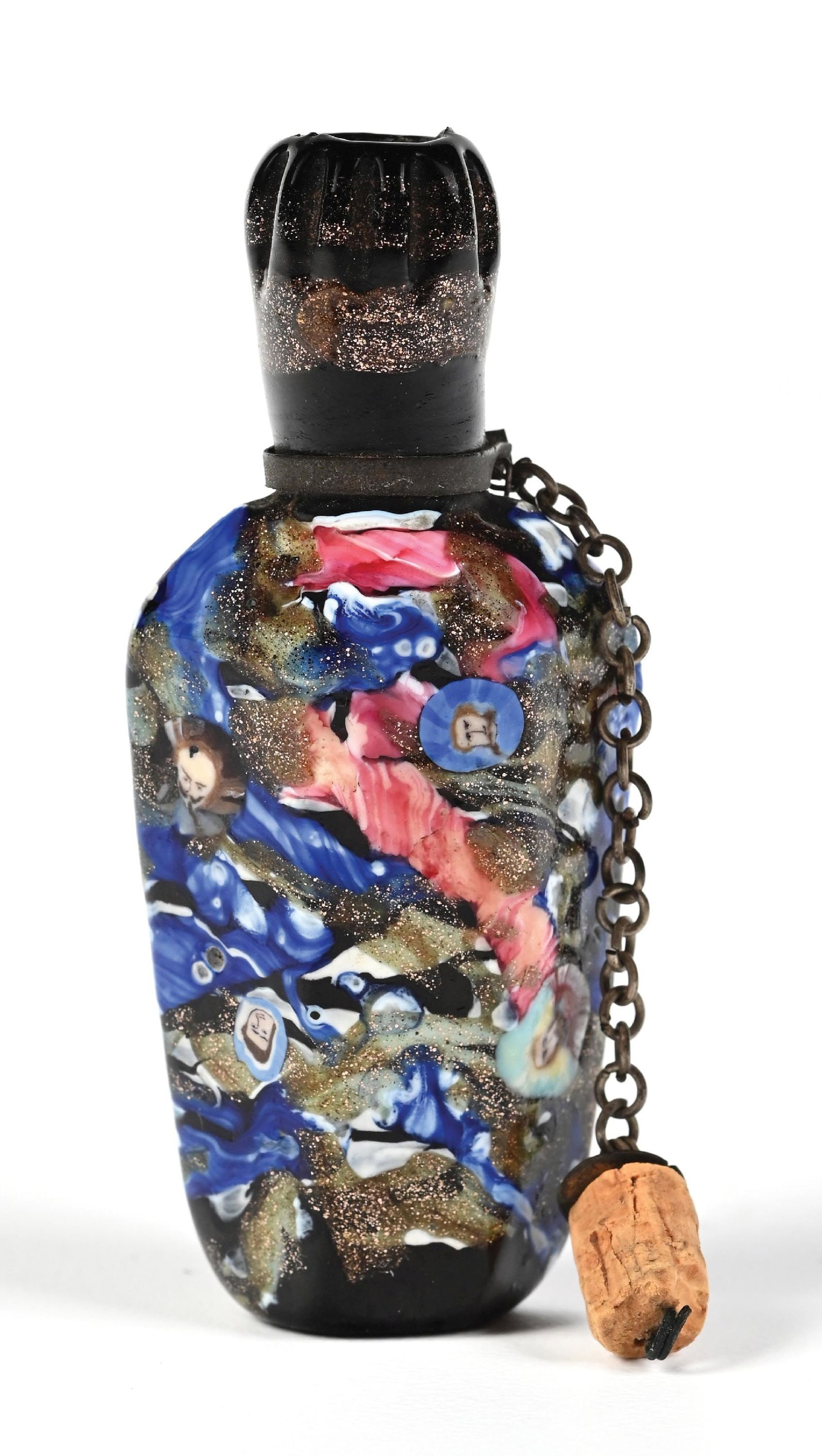 VENETIAN ART GLASS PERFUME BOTTLE: C. 1800s. A stunning small Venetian glass scent bottle, featuring multi-colored swirled glass with a golden aventurine glass that provides a golden speckling throughout the bottle. The original cork h