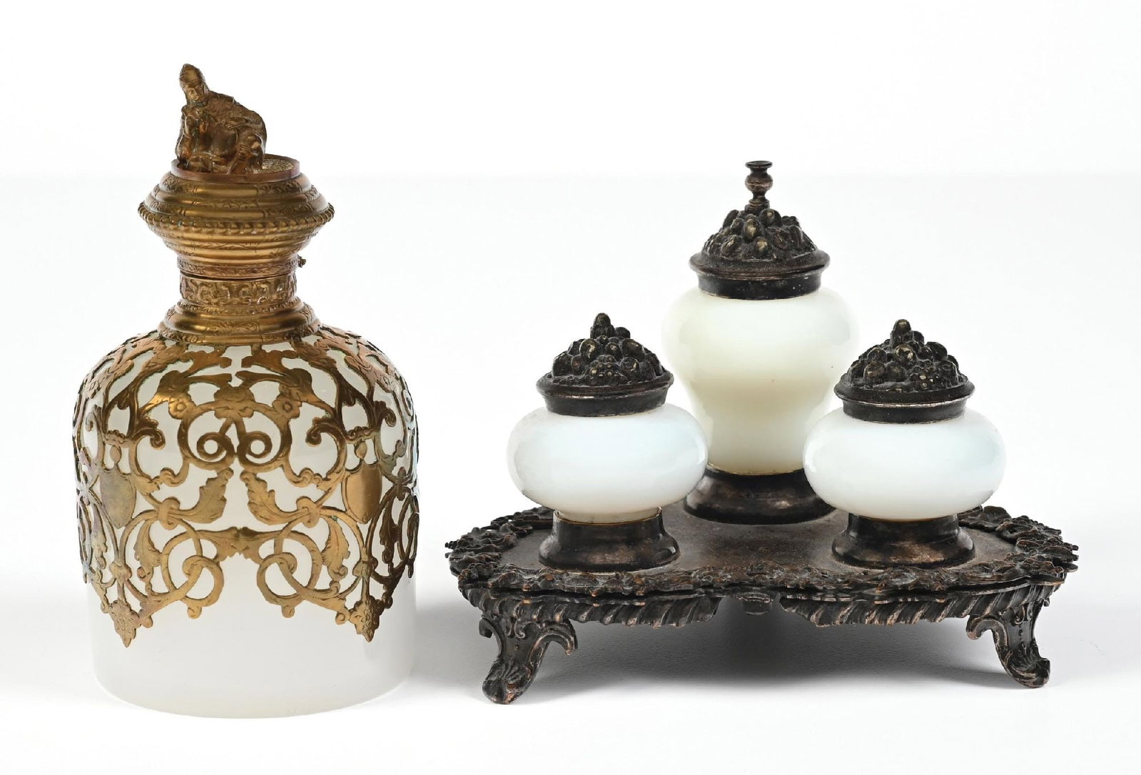 LOT OF 2: SILVER-PLATED OPALINE INKWELL SET & PERFUME BOTTLE: C. 1800s. (A) A Palais Royal scent bottle of white opaline glass with gilt ormolu mounts in a scrolling pattern over the body. The hinged lid is topped with a monk-form finial. Glass components presen