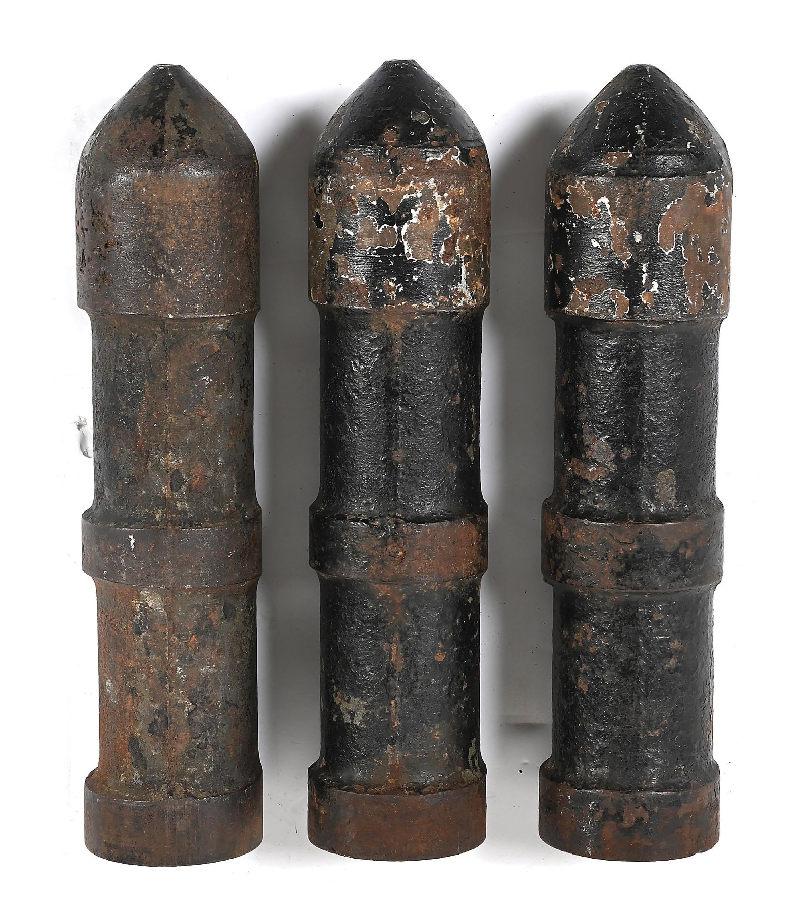LOT OF 3: SCARCE CAST IRON LINE THROWING CANNON PROJECTILES.: Lot consists of 3 early unmarked case iron shell shaped line thrower projectiles. Rather than attaching to line to a eye bolt at the front of the shell as is seen on most Lyle projectiles, the rope is