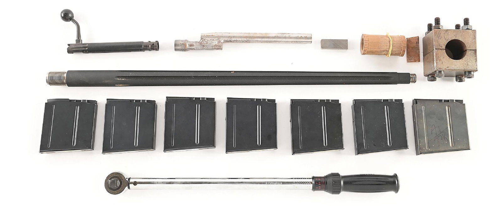 ACCURACY INTERNATIONAL .338 LAPUA MAGNUM CONVERSION SET.: Straight fluted, heavy tapered barrel chambered for .338 Lapua Magnum with .338 bolt body and 6 magazines. Also included are the instruction sheet, torque wrench, barrel clamp, and dummy bolt with wed
