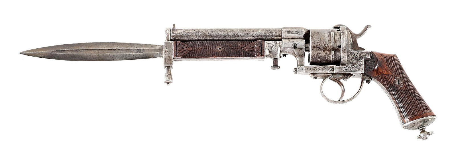 (A) RARE ENGRAVED BREVETTE LEFAUCHEUX DOUBLE ACTION REVOLVER WITH BAYONET.: Manufactured in Belgium circa 1870 and marked "E. LEFAUCHEUX / INVR BREVETTE". Round barrel with tall front sight and turned down muzzle to accept a baronet. Frame engraved throughout with vine motifs