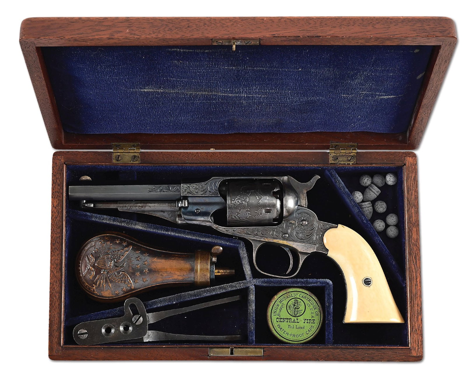 (A) FACTORY ENGRAVED REMINGTON NEW MODEL BELT MODEL SINGLE ACTION PERCUSSION REVOLVER IN CASE.: Remington Factory Engraved New Model Belt revolver with octagon barrel and 2 piece ivory grips. Scroll and vine engraved frame with chiseled bordered top strap and geometrically engraved trigger guard