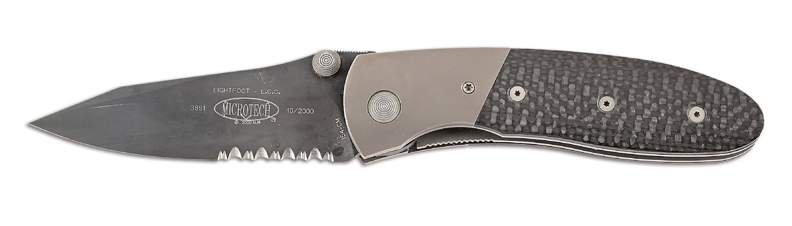 BOXED MICROTECH LIGHTFOOT.: Microtech Lightfoot LCC manual action features a black 154-CM serrated blade marked "LIGHTFOOT L.C.C." with Microtech logo. Numbered "3851" and dated "10/2000". Bead blasted titanium bolsters with
