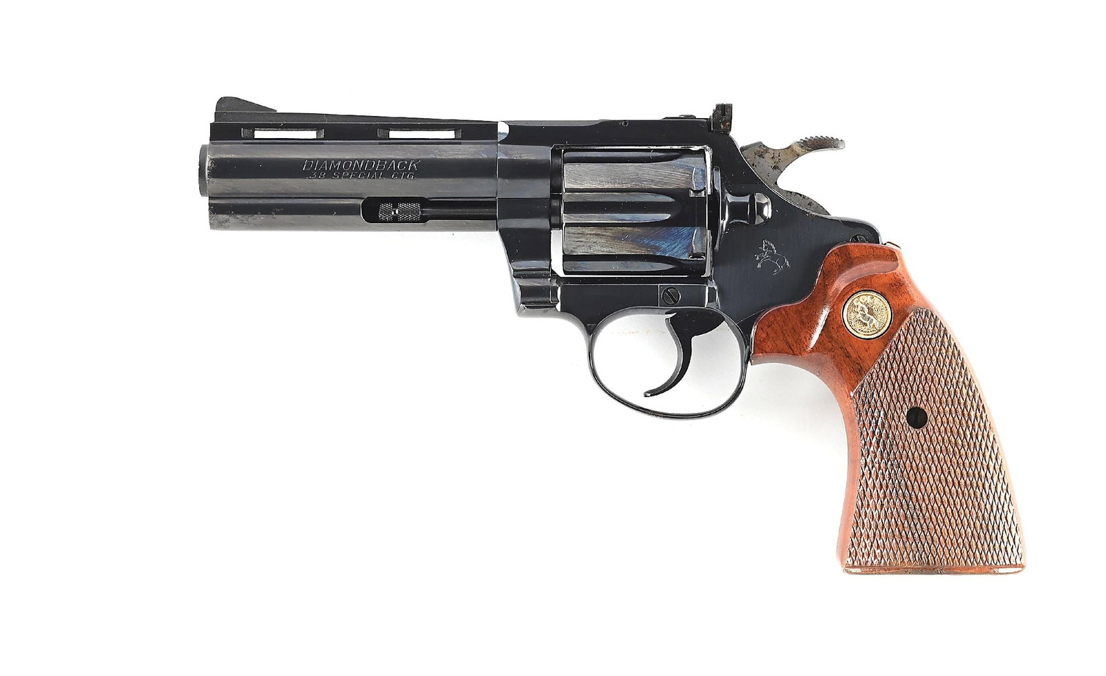 (M) COLT DIAMONDBACK .38 SPECIAL DOUBLE ACTION REVOLVER.: Dates to 1981. Classic features include the Colt blue finish, vent rib, adjustable rear sight, and Colt gold medallion checkered walnut grips. CONDITION: Excellent. Retains nearly all of its blue fini