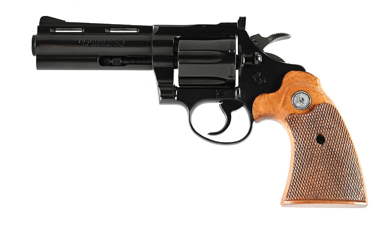 (C) COLT DIAMONDBACK .38 SPECIAL DOUBLE ACTION REVOLVER: Produced in 1968 with a polished blue finish with a bright hammer. The grips are two piece checkered walnut with flush inset silver medallions. The barrel is roll marked with the Colt address and mode