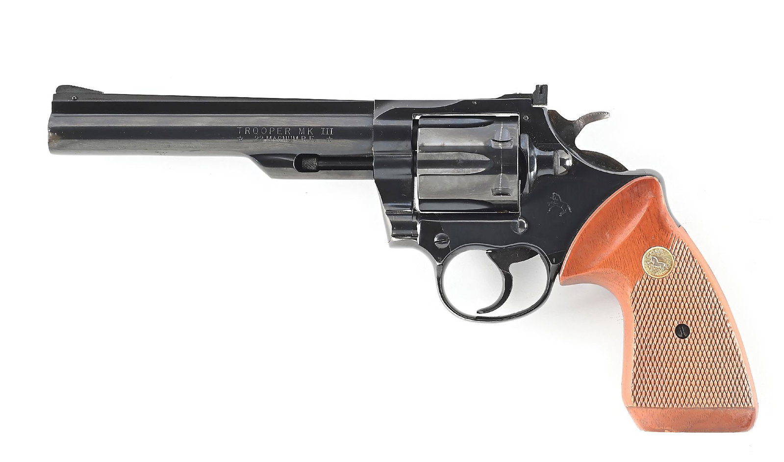 (M) COLT TROOPER MK III .22 MAGNUM DOUBLE ACTION REVOLVER.: Dates to 1980. Rather low production in this caliber. Features the standard blue finish, adjustable rear sight, solid rib, square butt with checkered walnut grips with gold Colt medallions. CONDITION: