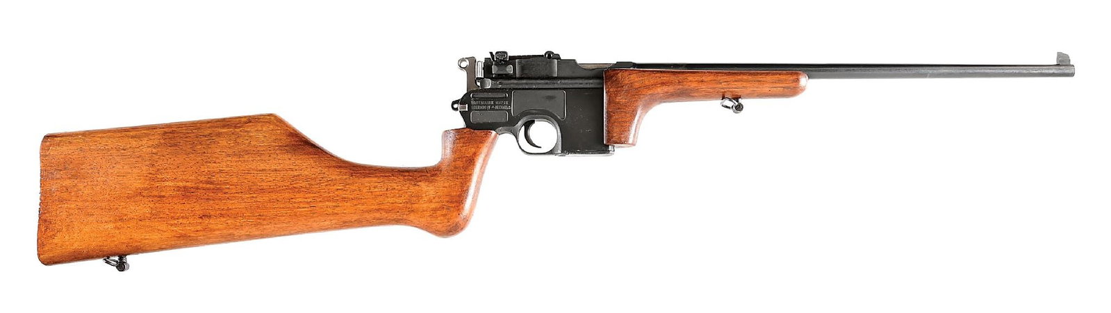 (C) MAUSER C96 7.65MM MAUSER SEMI-AUTOMATIC CARBINE: Built with an original Mauser C96 frame, this example has been converted to a carbine and imported by Navy Arms. The blued carbine length barrel has a tall blade front sight. Standard 1000 meter tange