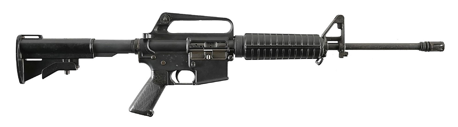 (M) PRE-BAN COLT SP1 SEMI-AUTOMATIC CARBINE.: Circa 1979. A1 style flash hider on pencil profile barrel with combination front sight block, bayonet lug, and gas assembly. Short ribbed polymer forearm, A1 style rear sight adjustable for windage on