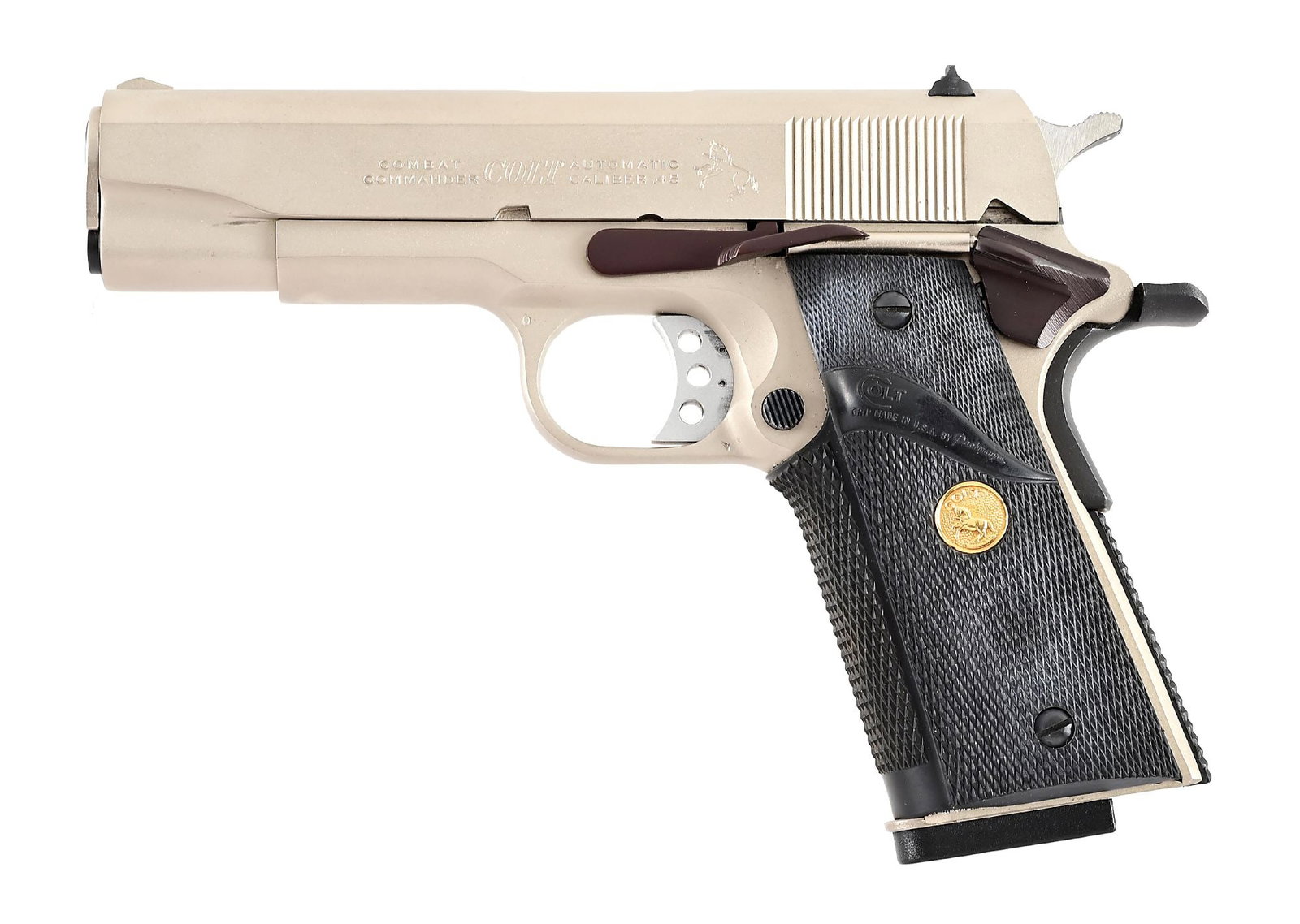 (M) CUSTOM COLT COMBAT COMMANDER 1911 SEMI-AUTOMATIC PISTOL WITH BOX.: Produced in 1981, this pistol features some custom additions. Blued extended slide release, blued safety lever and blued grip safety. The hammer is blued as well. Finished in factory satin nickel. It 