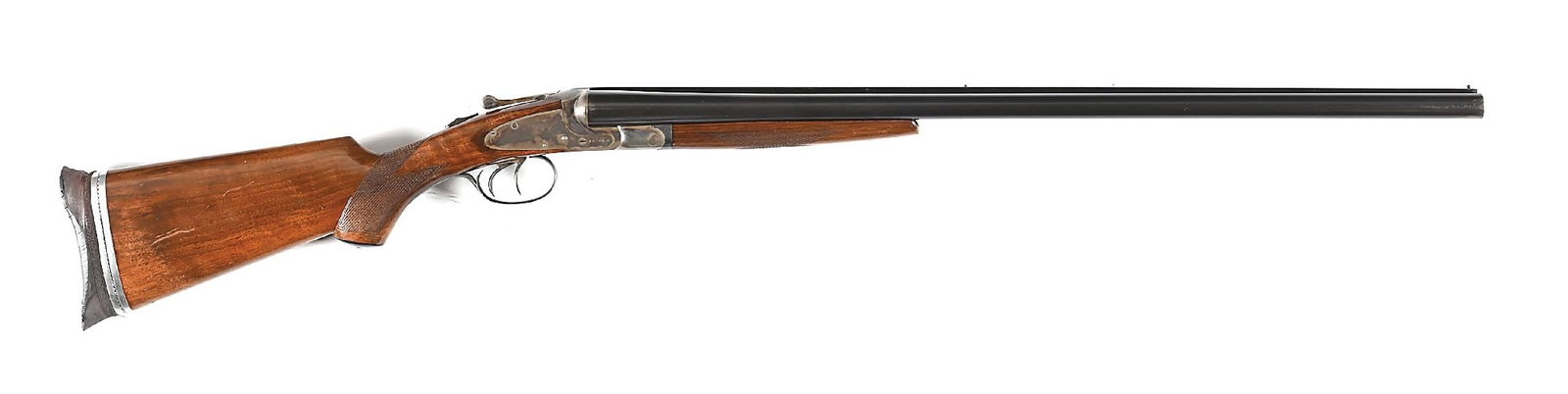 (C) L.C. SMITH FIELD GRADE FEATHERWEIGHT 12 GAUGE SIDE BY SIDE SHOTGUN.: Dates to 1940. Features case colored sidelocks, blued barrels with two beads, matted rib, makers legend, and extractors. Checkered walnut stock with pistol grip, add on Morgan adjustable buttpad, and 