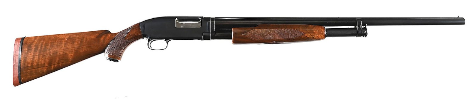 (C) SCARCE WINCHESTER MODEL 12 SUPER GRADE FIELD SLIDE ACTION SHOTGUN.: Only manufactured circa 1955 to 1959 as a deluxe field gun, this example built circa 1956. Blued Winchester proof steel barrel with solid matted rib, white Bradley style front sight, and white mid rib