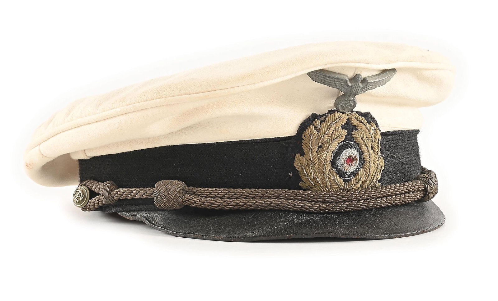 GERMAN WWII WHITE TOP KRIEGSMARINE VISOR CAP.: German WWII Kriegsmarine white top visor cap. Its aluminum eagle, bullion cockade, and officer's chin cord all exhibit heavy patina. Black center band and white top exhibit wear and staining. Visor ha