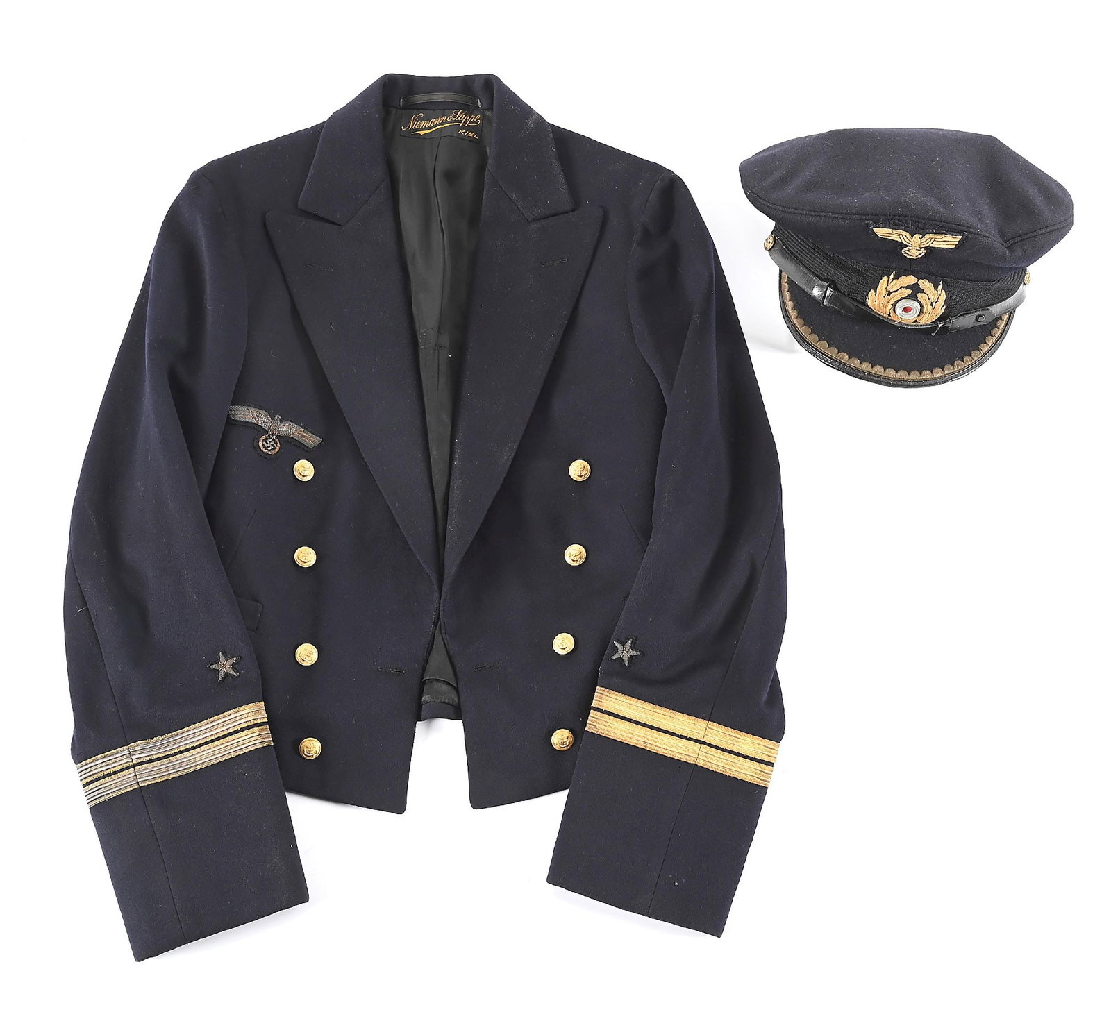 LOT OF 2: GERMAN WWII KRIEGSMARINE OFFICER TUNIC AND VISOR CAP.: Lot contains: (A) German WWII Kriegsmarine "Oberleutnant" tunic made from a high quality dark blue wool with very light wear and no visible damage. The tailor label "Niewman & Lappe, Kiel" is present 