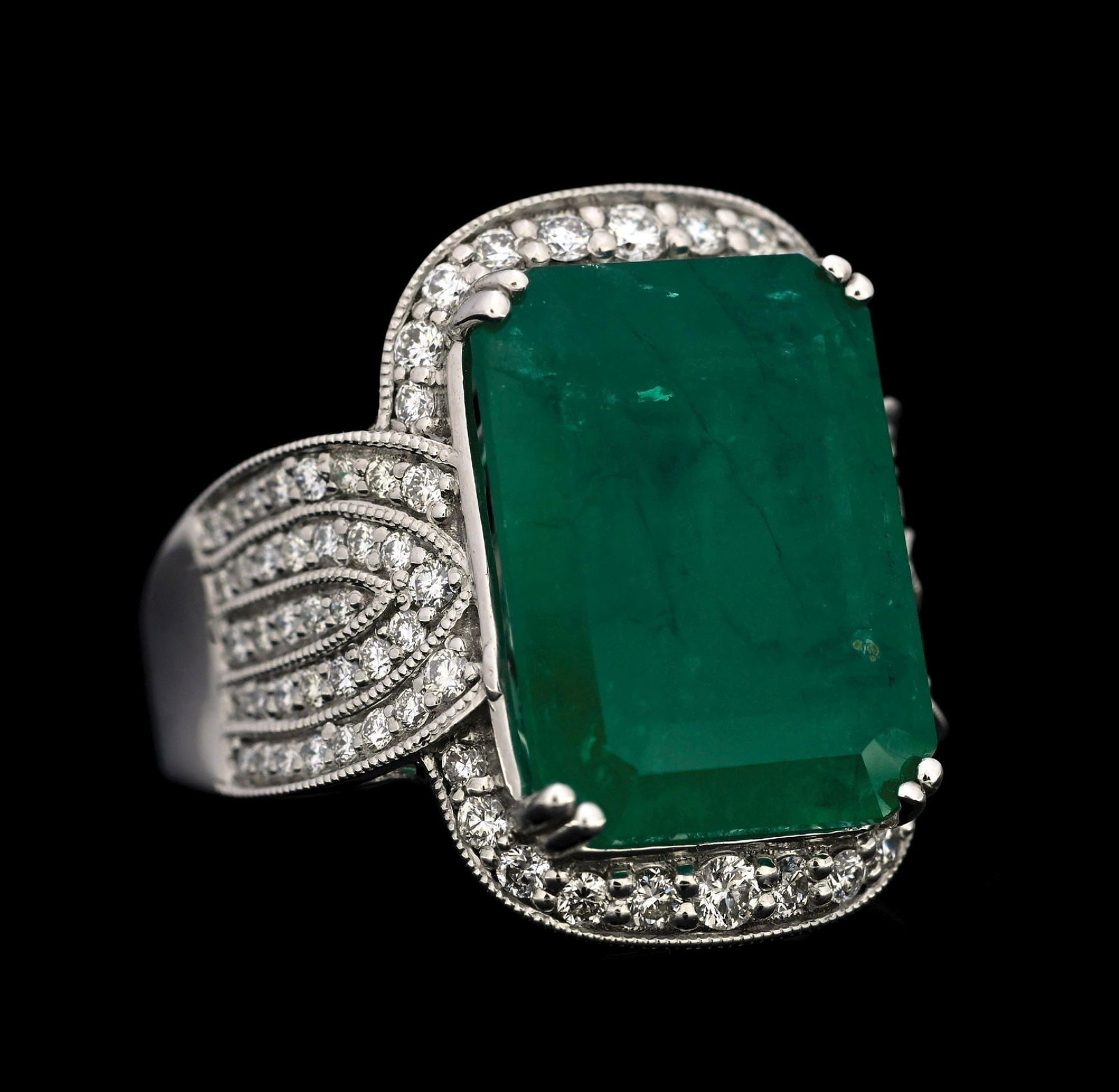PLATINUM EMERALD & DIAMOND RING W/GIA REPORT: Platinum emerald (8.80ct) and diamond (0.76ctw) ring accompanied by an original GIA emerald origin report and a GGA appraisal report with an ERRV of $38,970.00. (See additional website images for repo