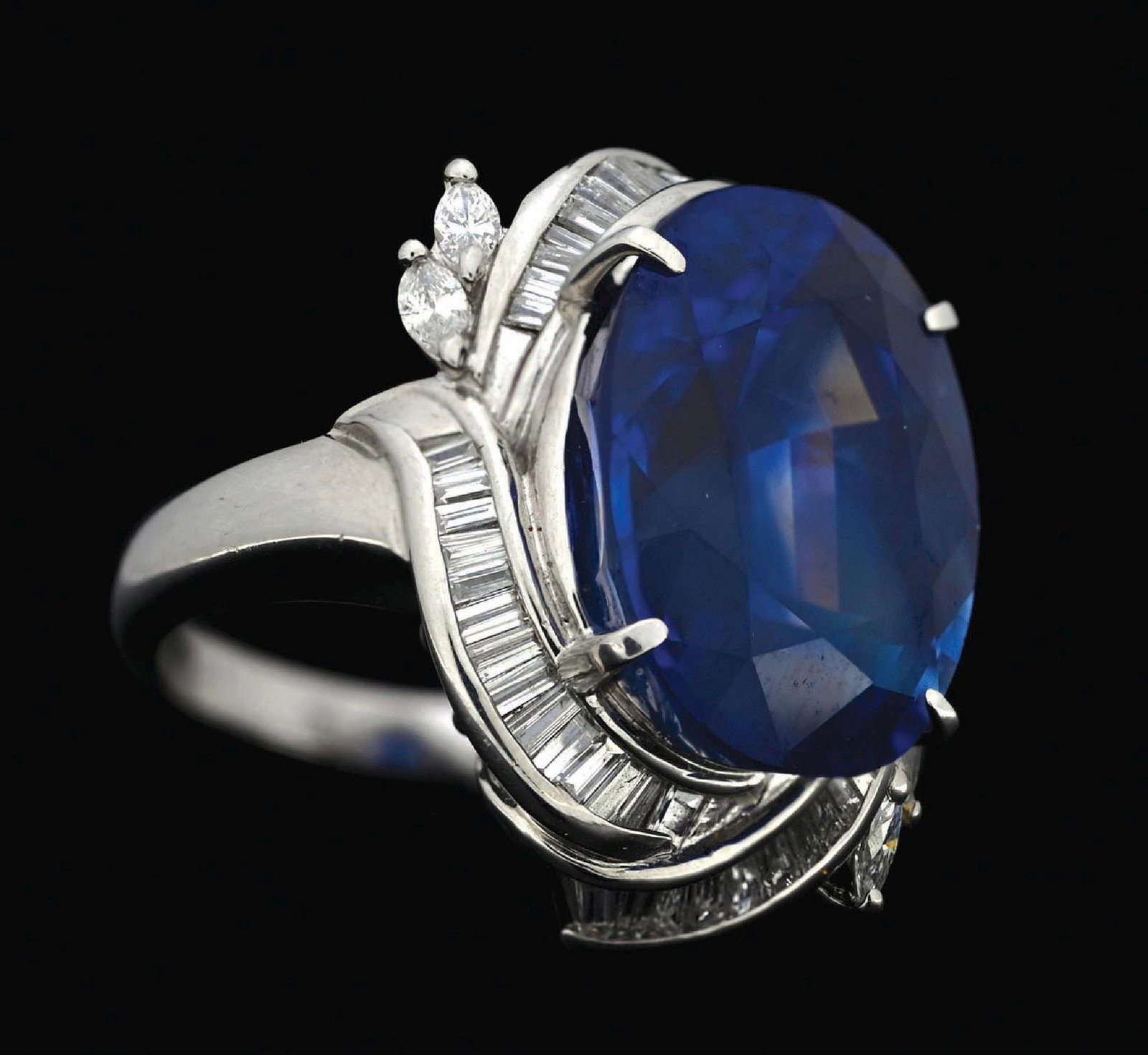 PLATINUM SAPPHIRE & DIAMOND RING W/GIA REPORT: Platinum sapphire (15.94ct) and diamond (0.93ctw) ring accompanied by an original GIA sapphire origin report and an AIGL appraisal report with an ERRV of $193,870.00. (See additional website images fo