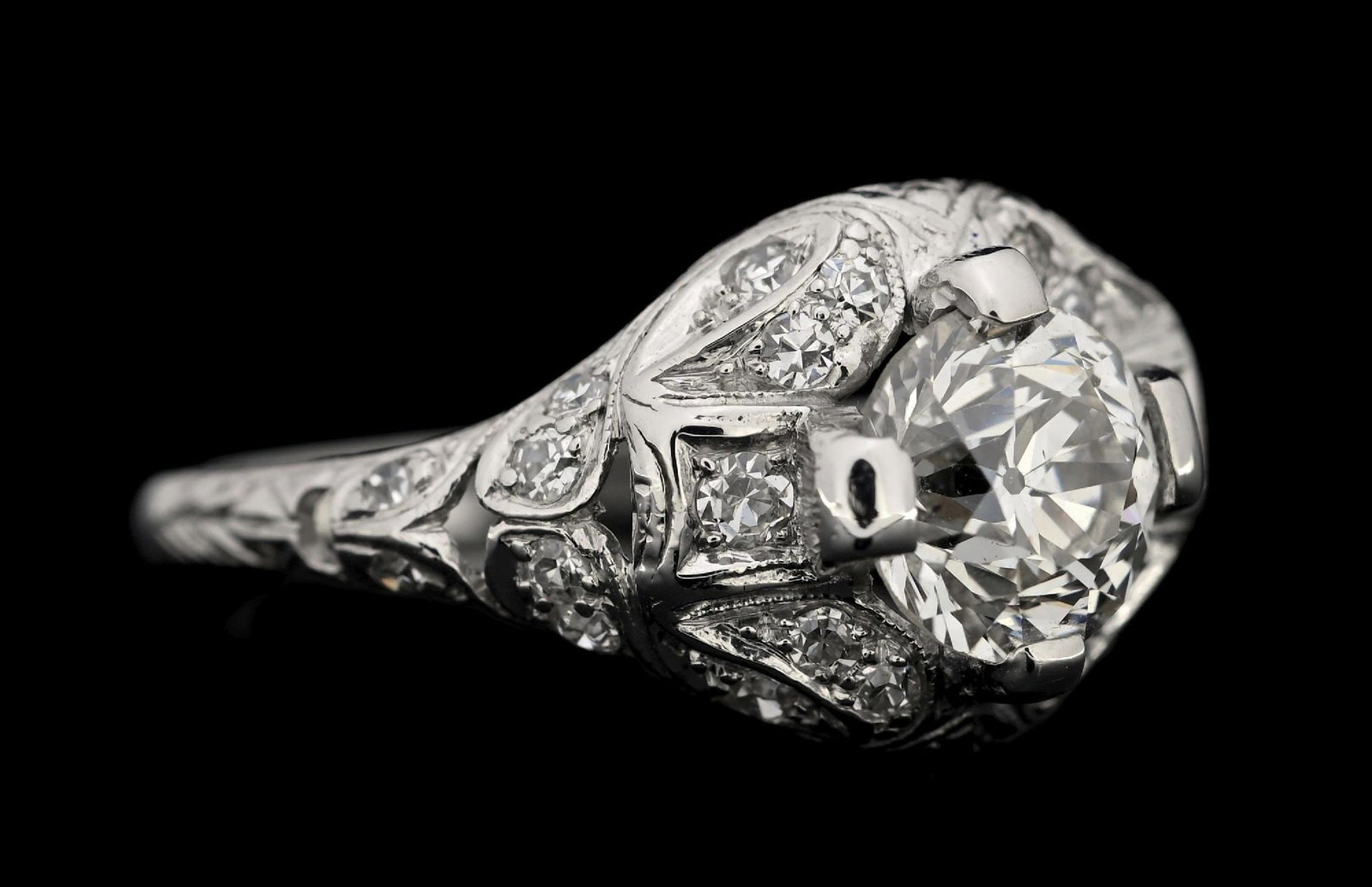 PLATINUM ESTATE 1.65CT TW DIAMOND RING W/REPORT: Platinum old European cut diamond (1.15ct) and diamond (0.50ctw) estate engagement ring accompanied by an original GGA appraisal report with an ERRV of $35,260.00. (See additional website images for r