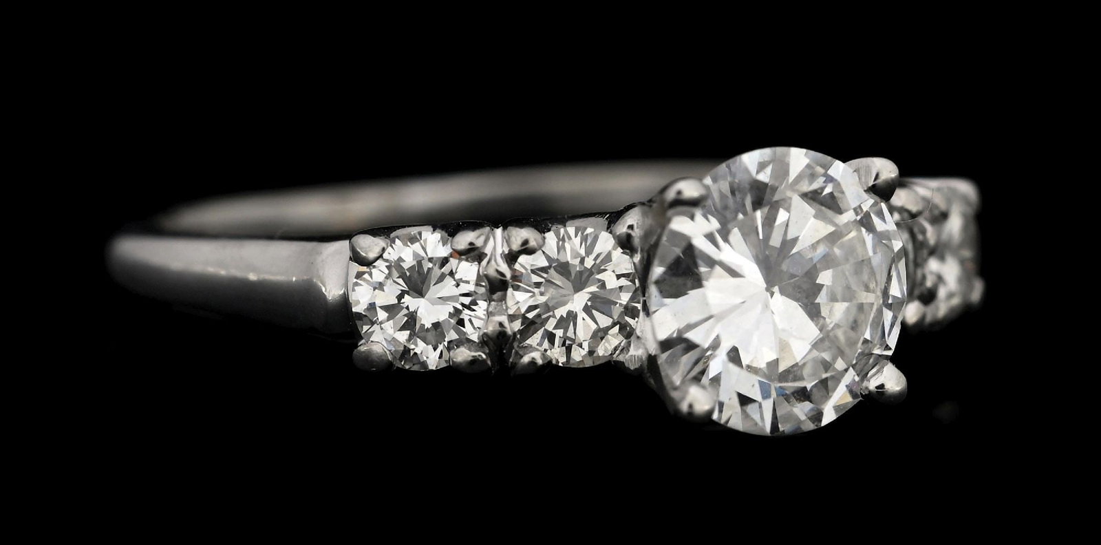 14K WHITE GOLD 1.53CT TW DIAMOND ENGAGEMENT RING W/REPORT: 14k white gold diamond (1.03ct center, 0.50ctw sides) engagement ring accompanied by an original GGA appraisal report with an ERRV of $19,570.00. (See additional website images for report specificatio