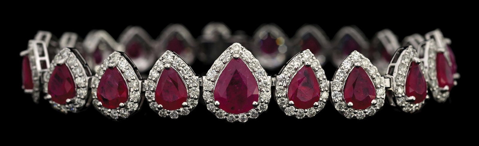 PLATINUM RUBY & DIAMOND BRACELET W/GIA REPORT: Platinum ruby (13.16ctw) and diamond (4.98ctw) bracelet accompanied by an original GIA ruby origin report and an AIGL appraisal report with an ERRV of $42,640.00. (See additional website images for re