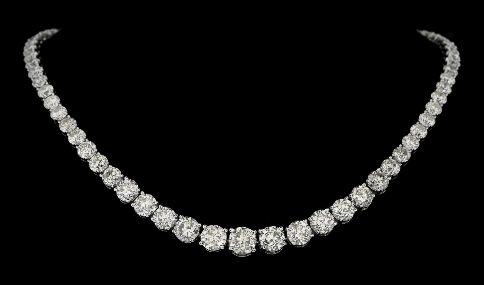 PLATINUM 57.58CT TW DIAMOND NECKLACE WITH W/REPORT: Platinum graduated natural diamond (57.58ctw) statement necklace accompanied by an original GGA appraisal report with an ERRV of $372,580.00. (See additional website images for report specifications).