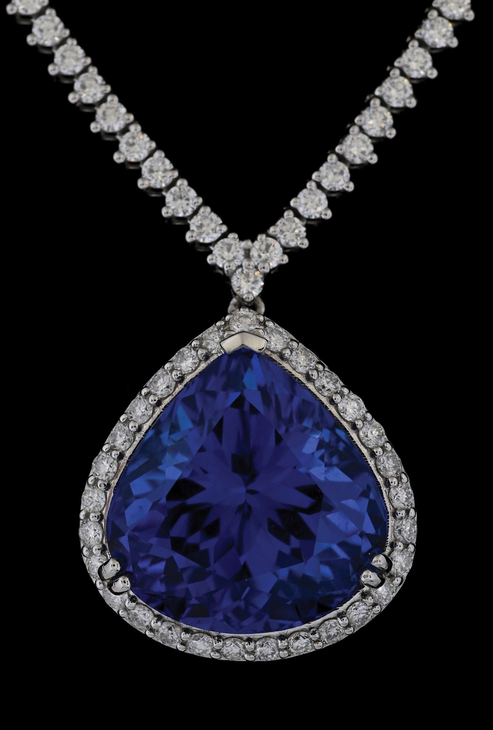 PLATINUM 20.81CT TANZANITE & DIAMOND NECKLACE W/GIA REPORT: Platinum tanzanite (20.81ct) and diamond (6.19ctw) necklace accompanied by an original GIA identification report and a GGA appraisal report with an ERRV of $141,370.00. (See additional website images 